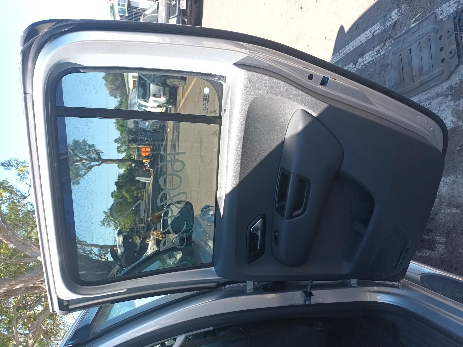 The Back Door of a Silver Car is Open — South West 4WD Wreckers In Brisbane, QLD