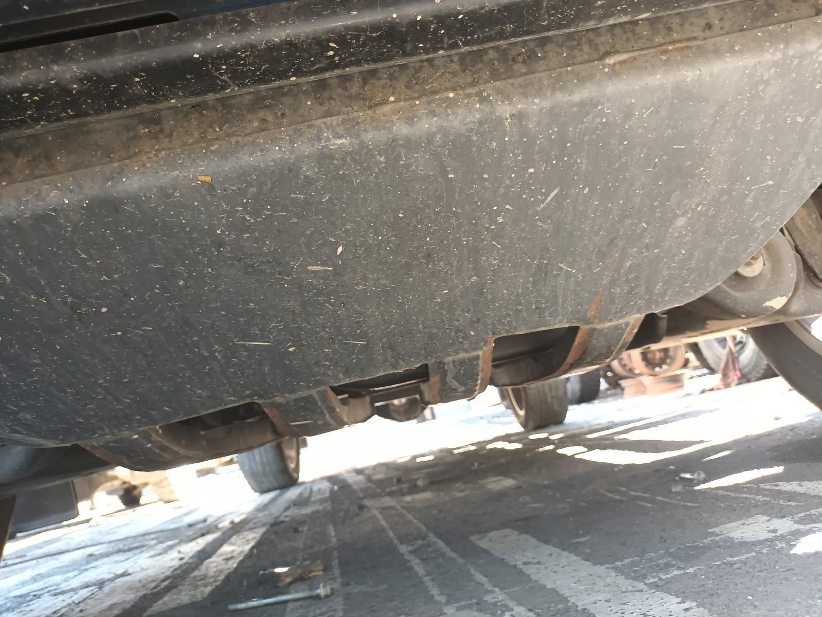 A Black Car is Parked on the Side of the Road — South West 4WD Wreckers In Brisbane, QLD