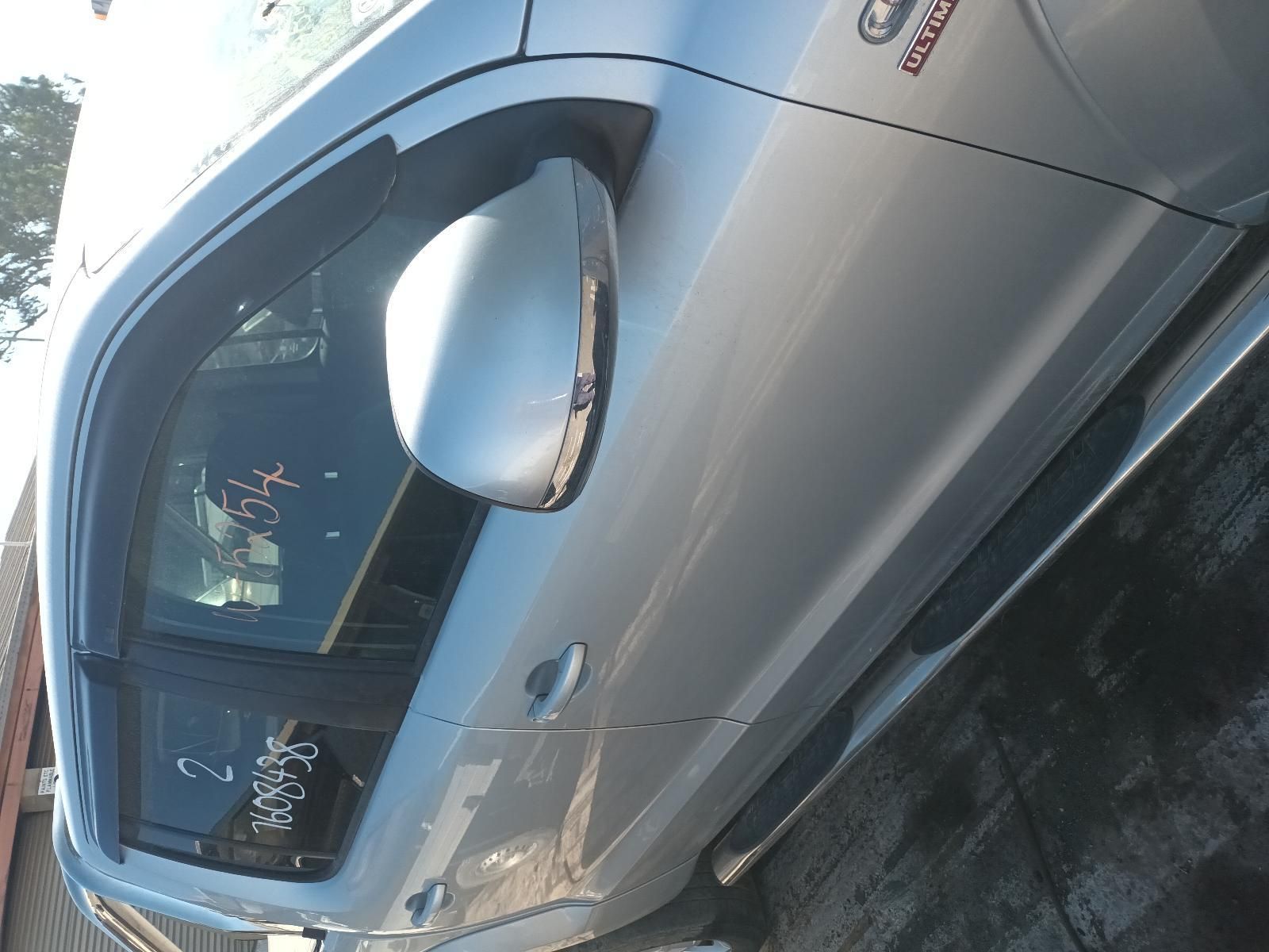 A Silver Car is Parked on the Side of the Road — South West 4WD Wreckers In Brisbane, QLD