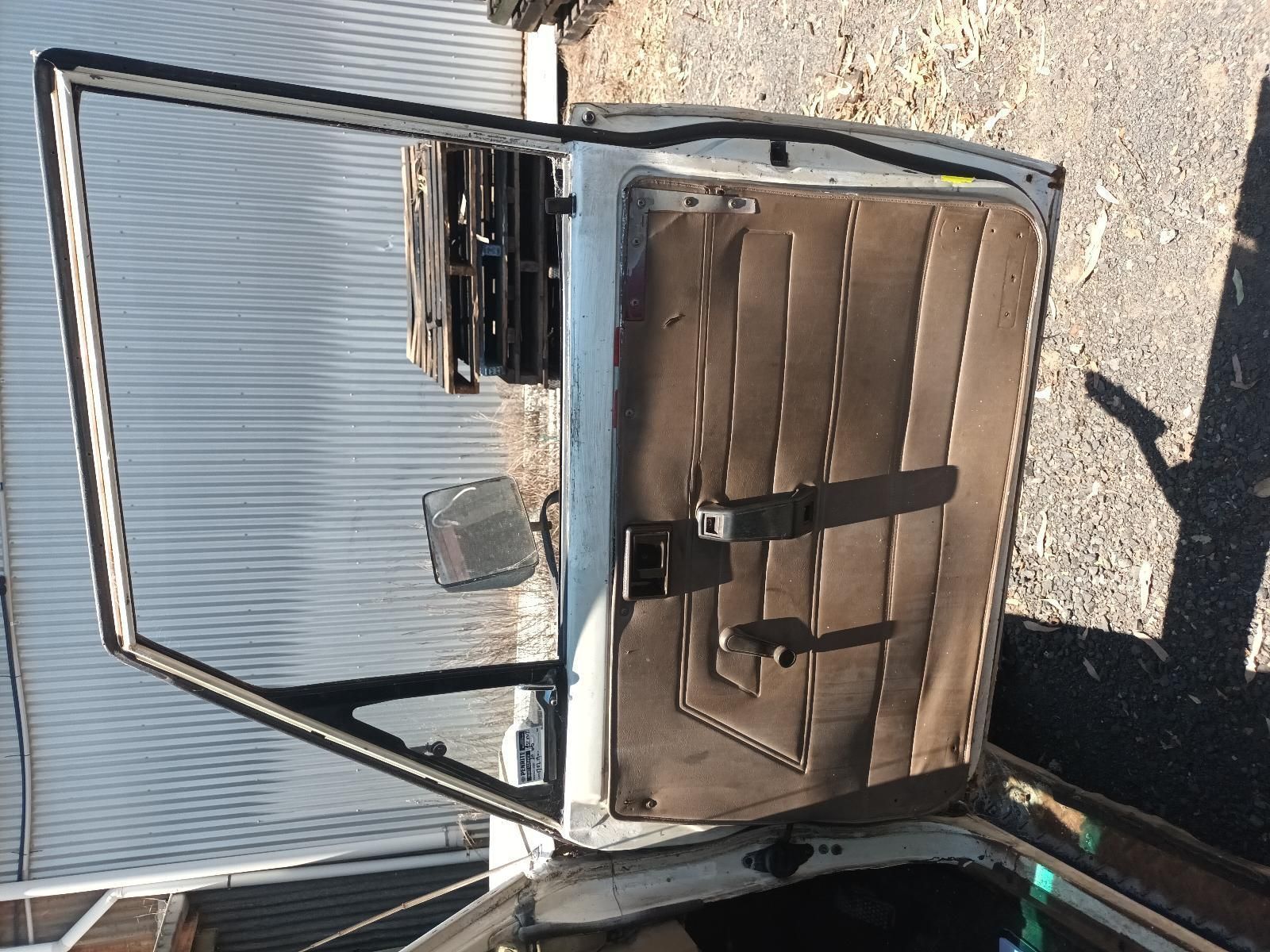 A Car Door is Open and Sitting on the Ground — South West 4WD Wreckers In Brisbane, QLD