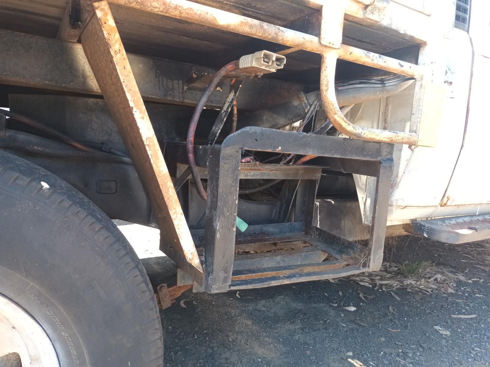 A White Truck is Parked on the Side of the Road — South West 4WD Wreckers In Brisbane, QLD