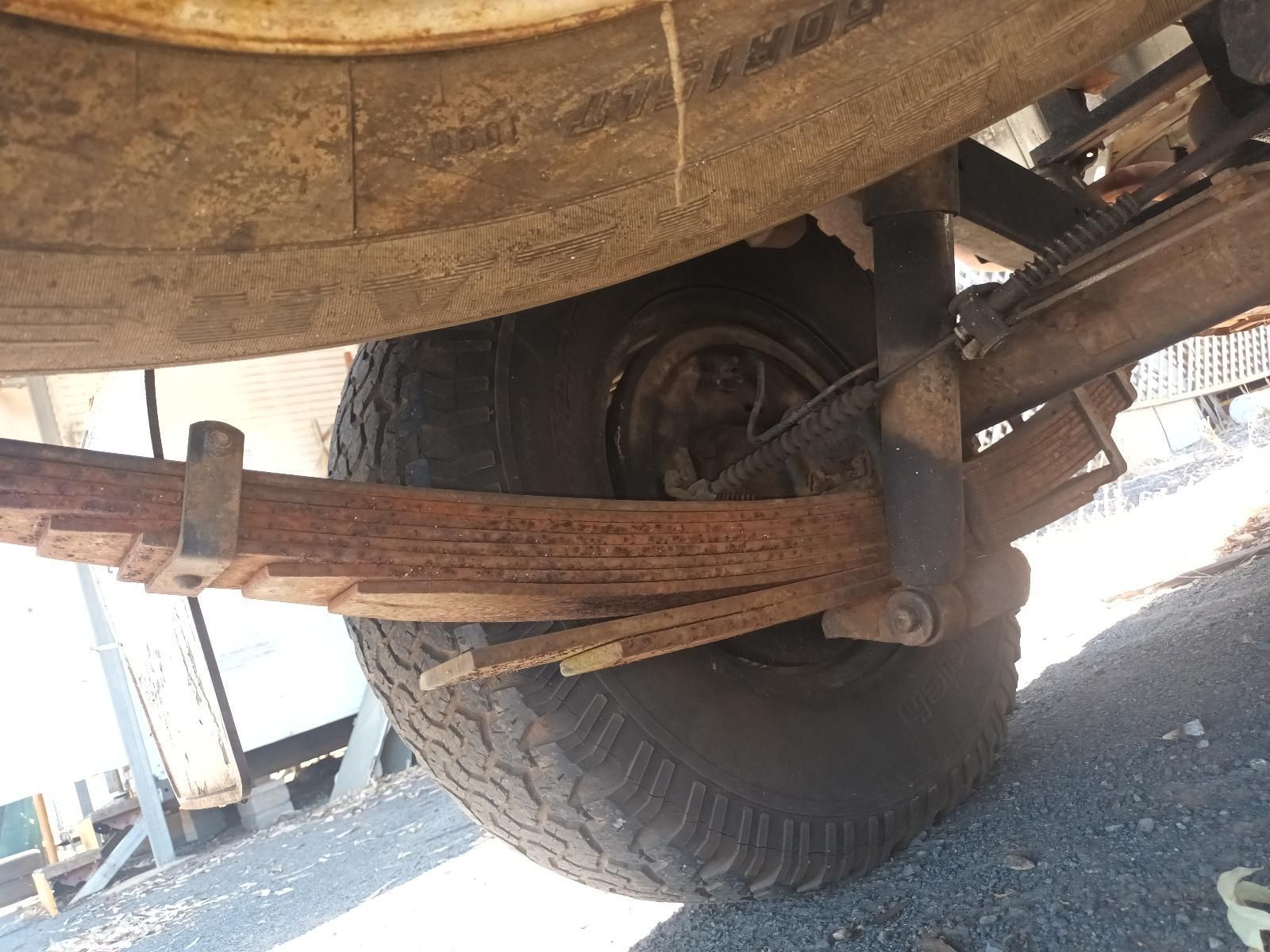 A Close Up of a Tire and Leaf Springs on a Truck — South West 4WD Wreckers In Brisbane, QLD