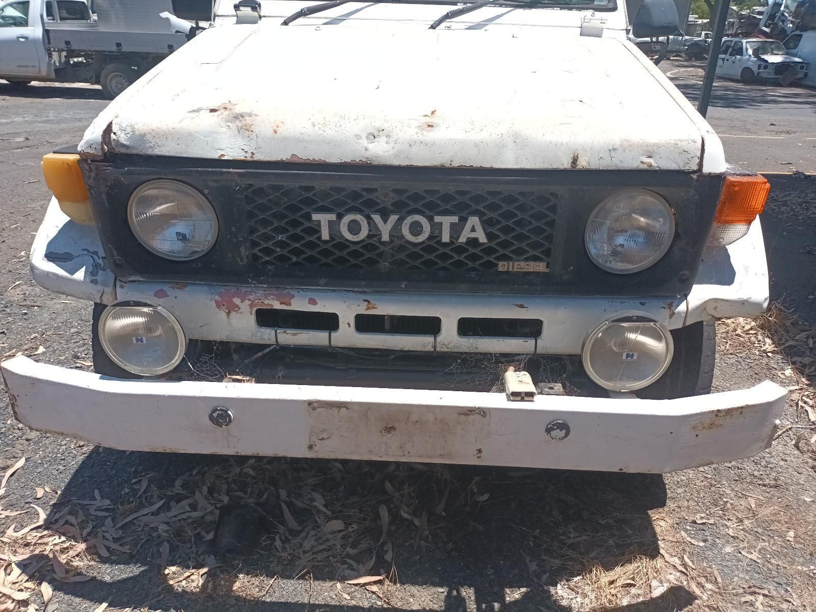 A White Toyota Truck is Parked in a Parking Lot — South West 4WD Wreckers In Brisbane, QLD