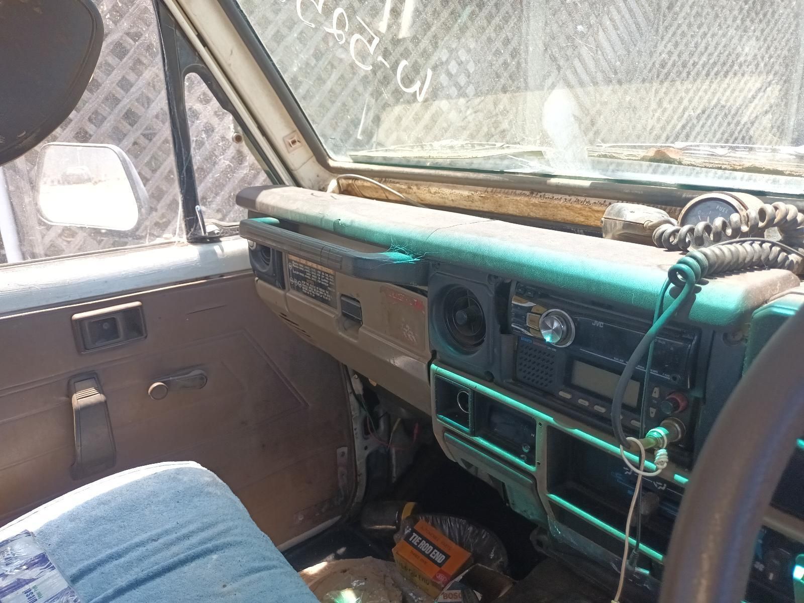 The Dashboard of an Old Car with a Walkie Talkie Attached to It — South West 4WD Wreckers In Brisbane, QLD