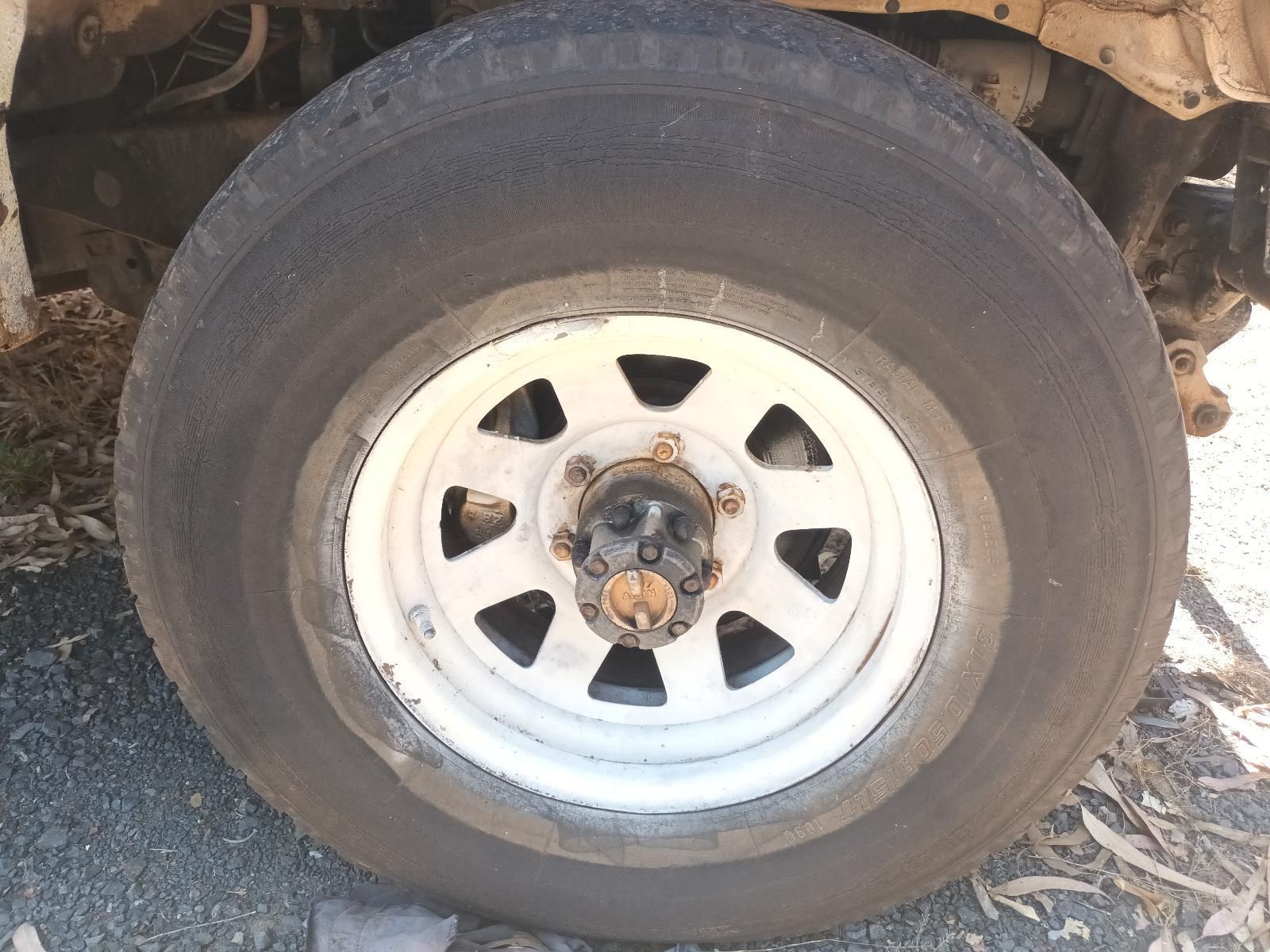 A Close Up of a Car Tire with a White Rim — South West 4WD Wreckers In Brisbane, QLD