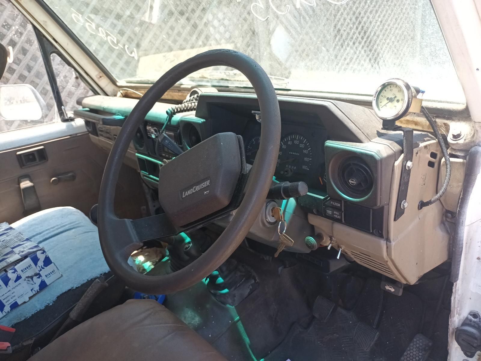 The Inside of a Car with a Steering Wheel That Says Land Cruiser on It — South West 4WD Wreckers In Brisbane, QLD
