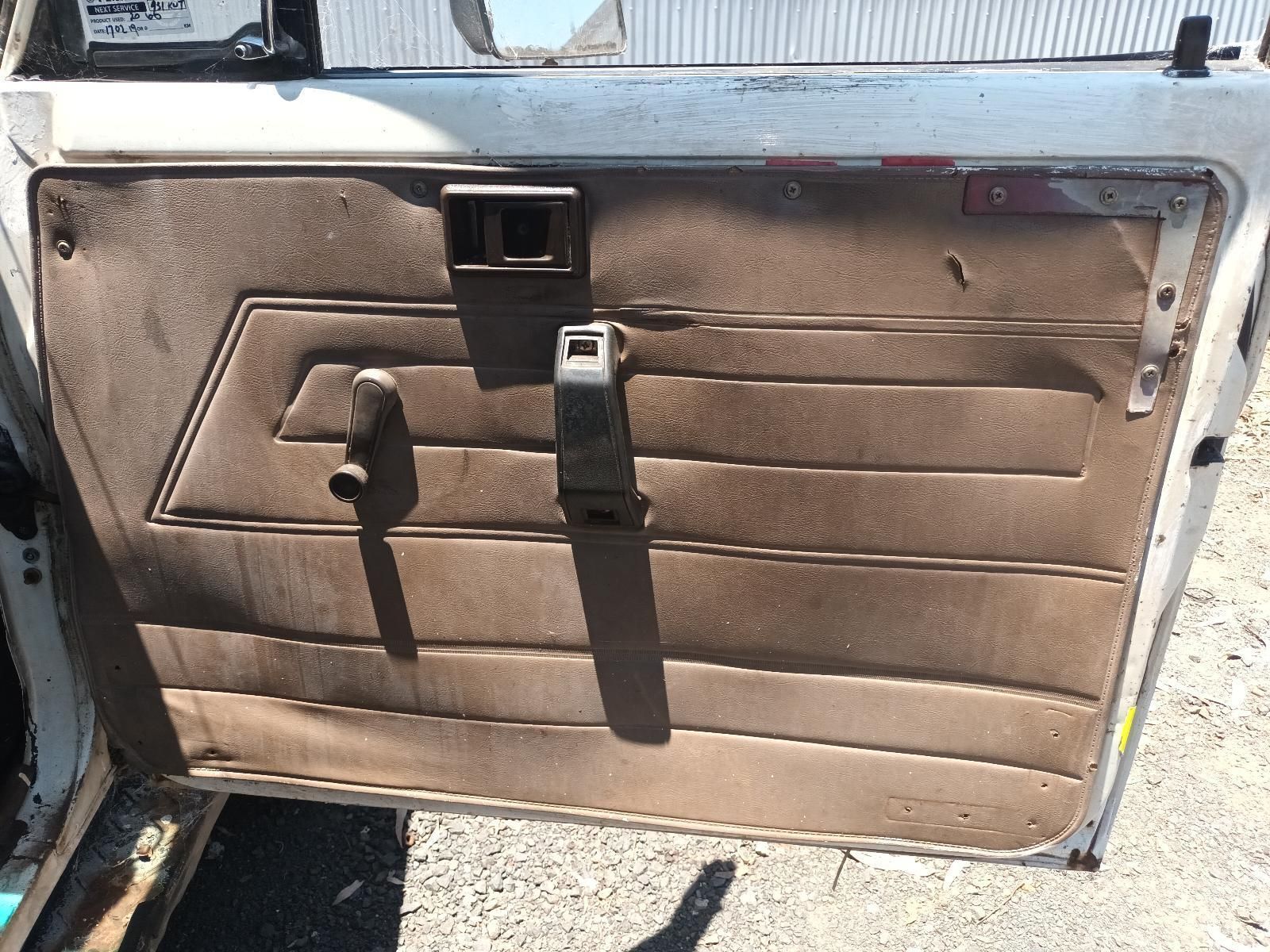 A Close Up of a Car Door with a Shadow on the Ground — South West 4WD Wreckers In Brisbane, QLD