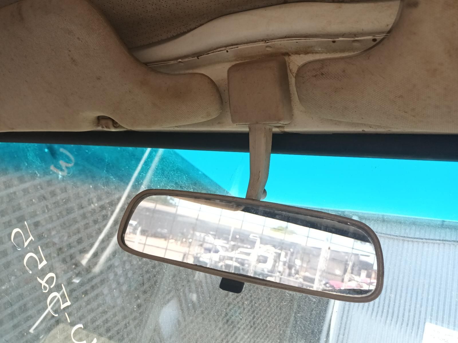 A Dirty Rear View Mirror on a Car with a Blue Sky in the Background — South West 4WD Wreckers In Brisbane, QLD