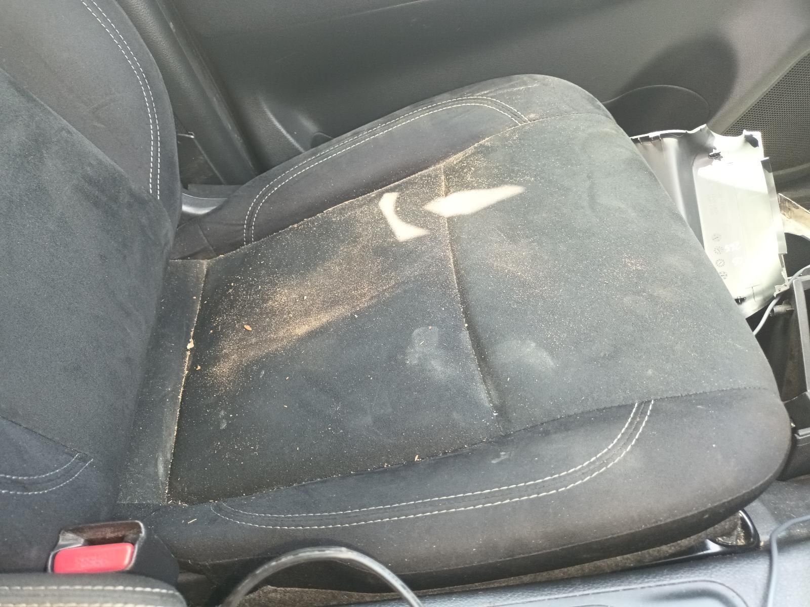 A Dirty Car Seat with a Red Safety Belt on It — South West 4WD Wreckers In Brisbane, QLD
