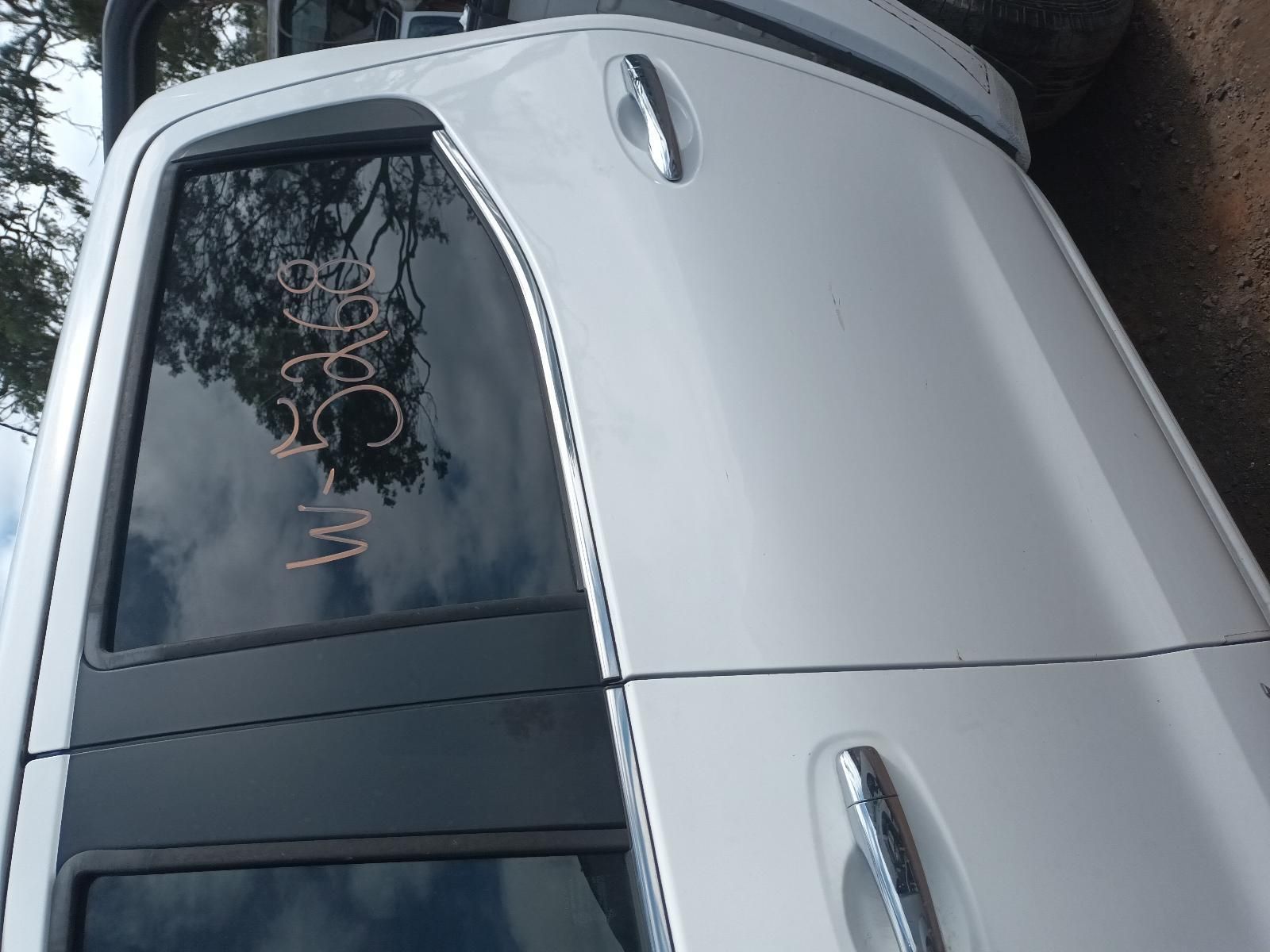 A White Car is Parked on the Side of the Road — South West 4WD Wreckers In Brisbane, QLD