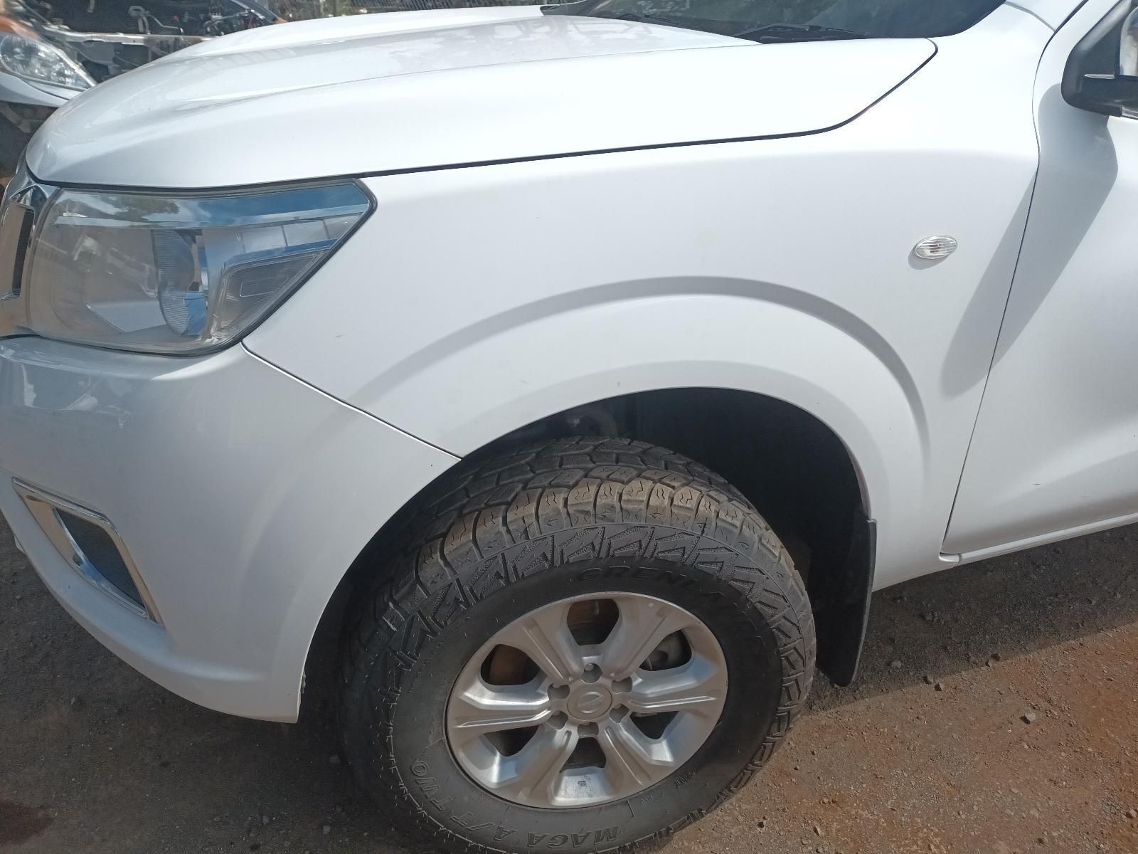 A White Truck is Parked on the Side of the Road — South West 4WD Wreckers In Brisbane, QLD
