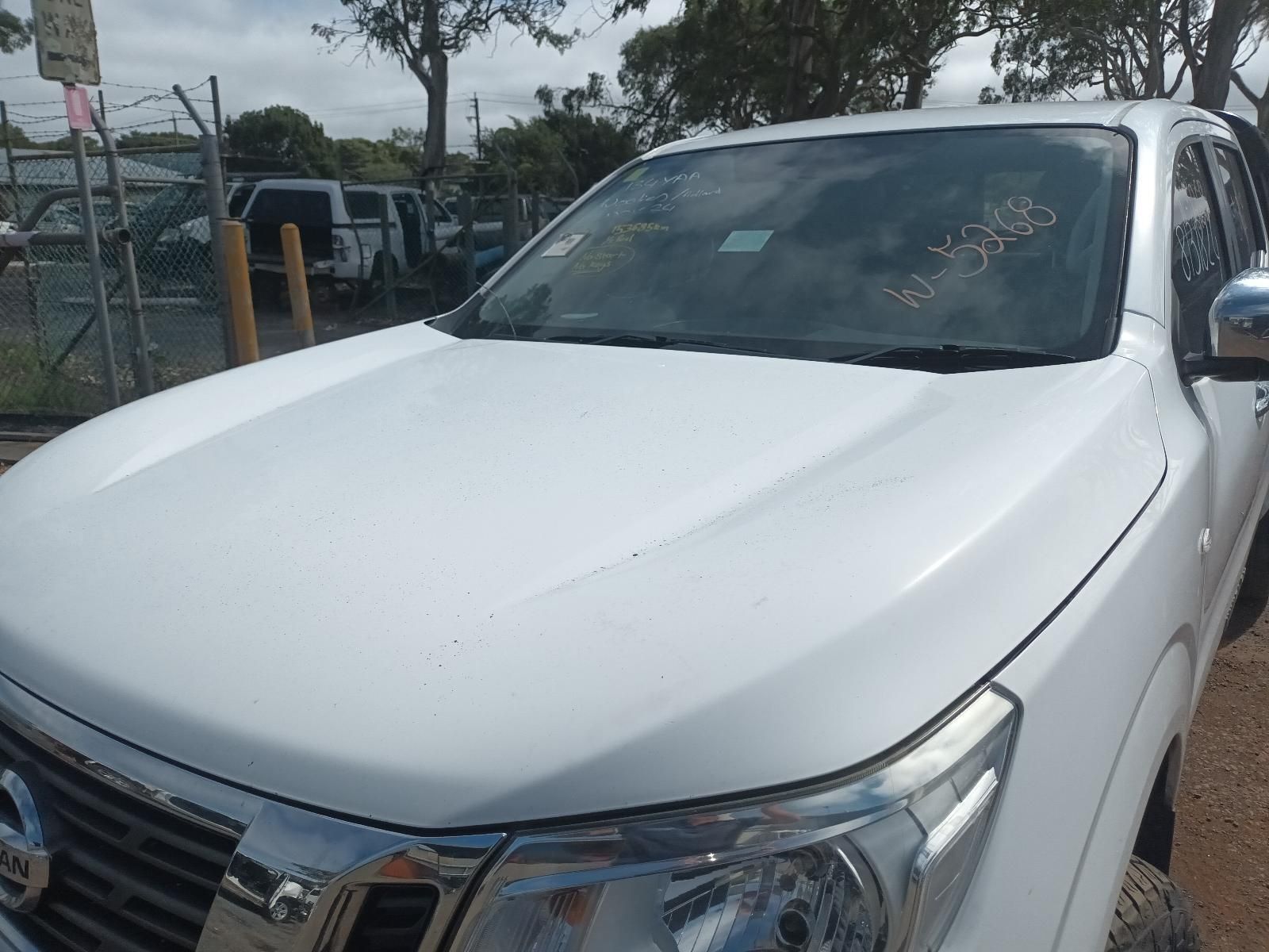 A White Truck is Parked in a Parking Lot — South West 4WD Wreckers In Brisbane, QLD
