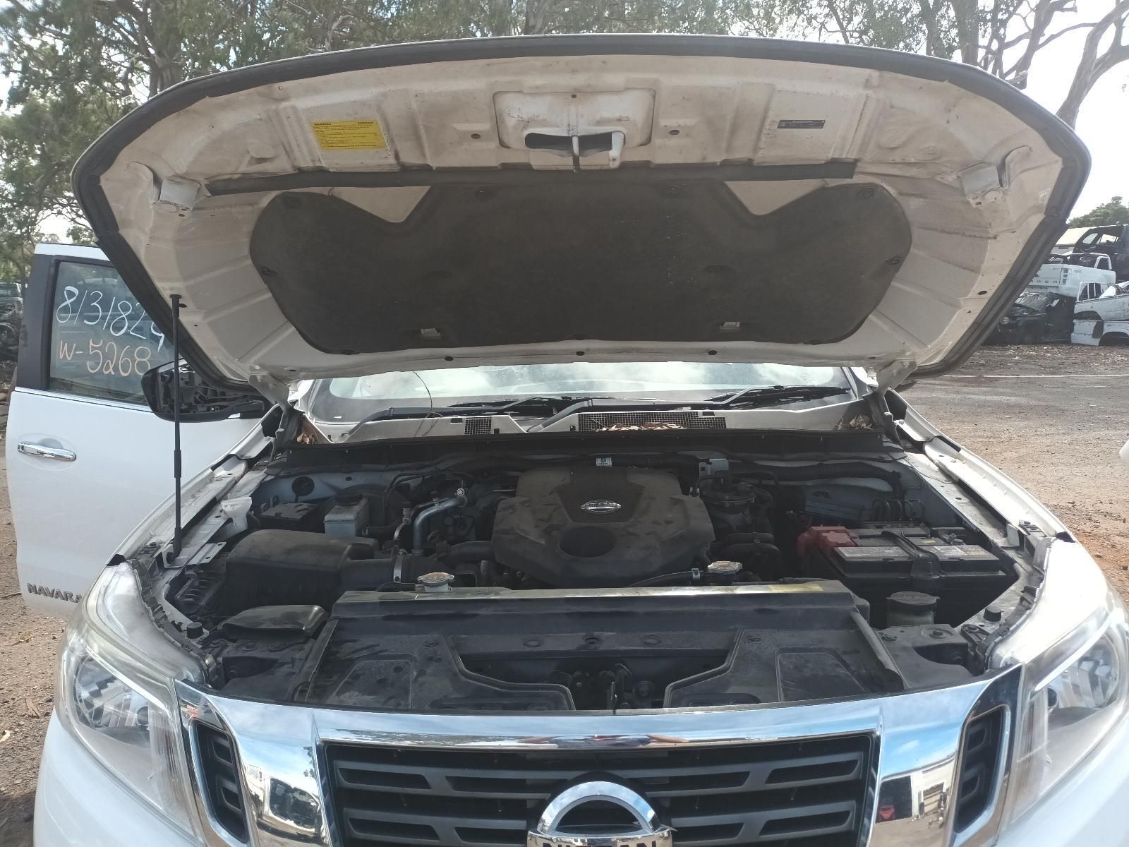 The Hood of a White Nissan Truck is Open — South West 4WD Wreckers In Brisbane, QLD