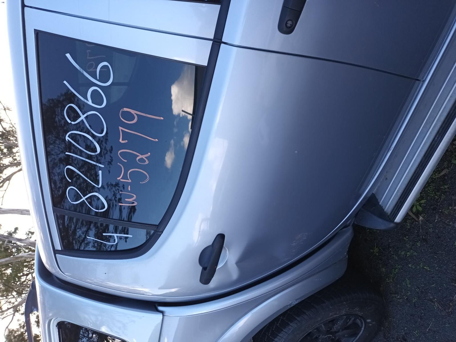 A Silver Car is Parked on the Side of the Road — South West 4WD Wreckers In Brisbane, QLD