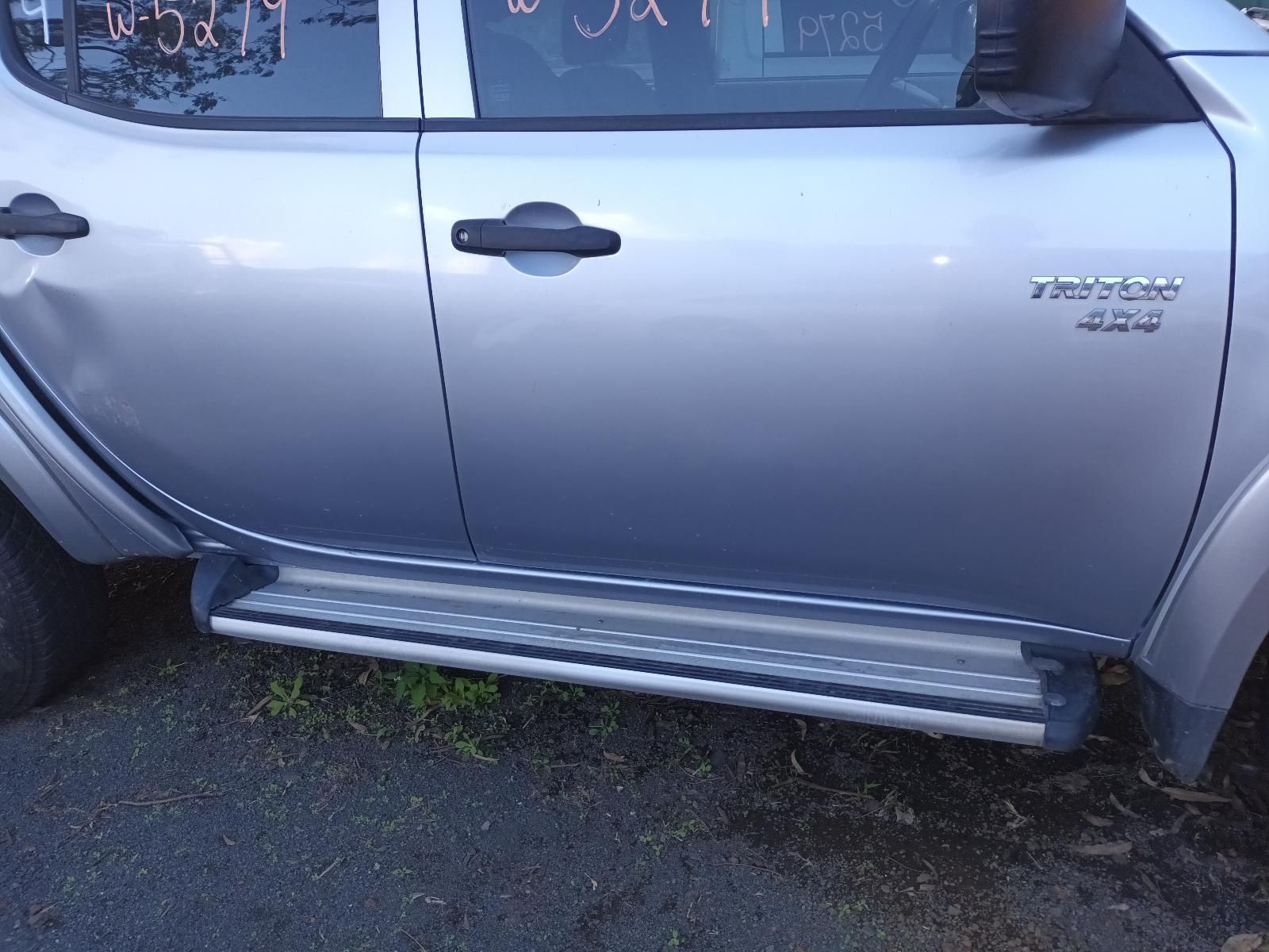 A Silver Truck is Parked on the Side of the Road — South West 4WD Wreckers In Brisbane, QLD
