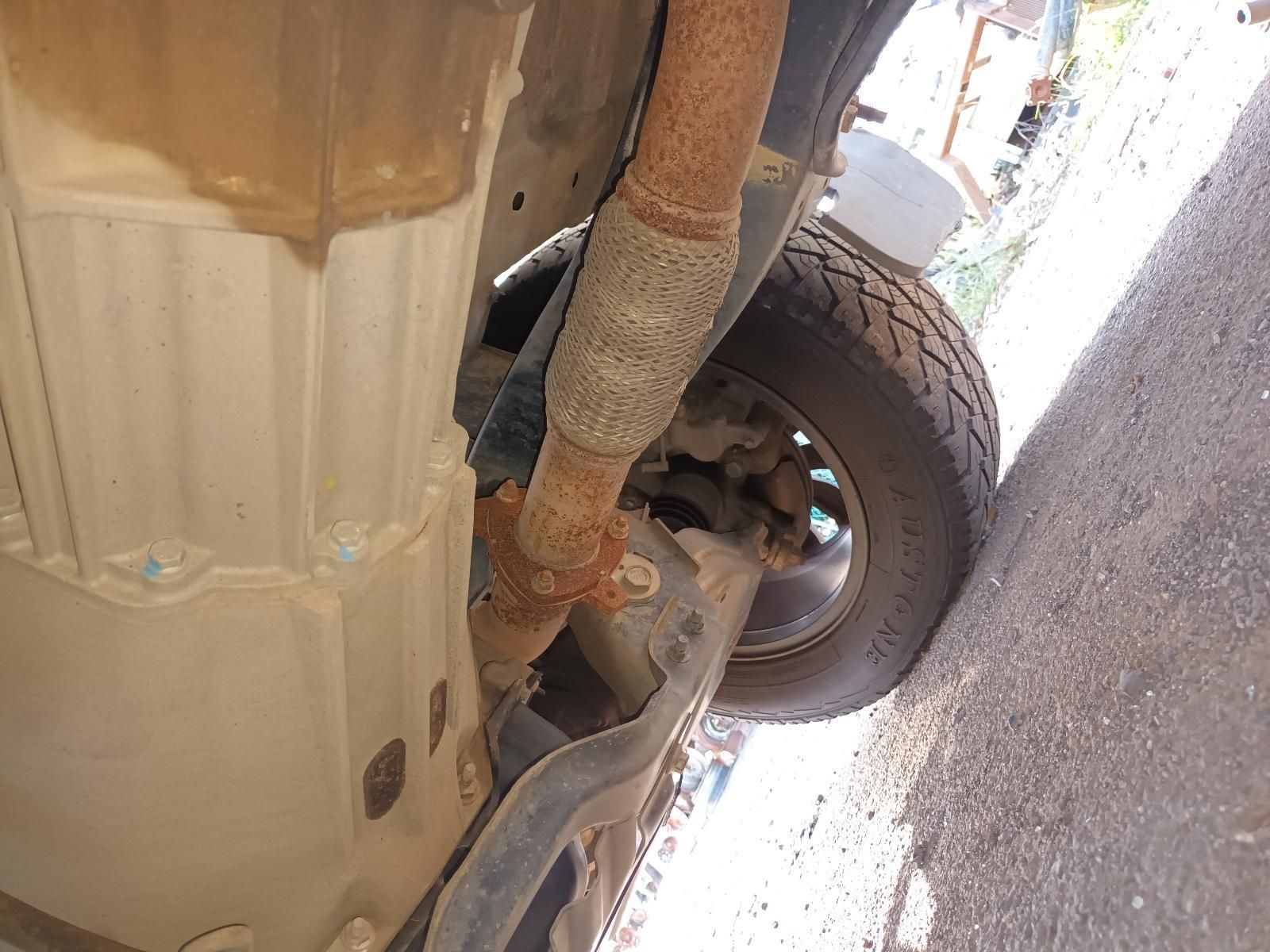 A Close Up of the Underside of a Car with a Rusty Exhaust Pipe — South West 4WD Wreckers In Brisbane, QLD