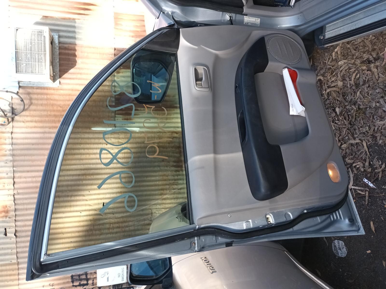 A Car with the Door Open — South West 4WD Wreckers In Brisbane, QLD