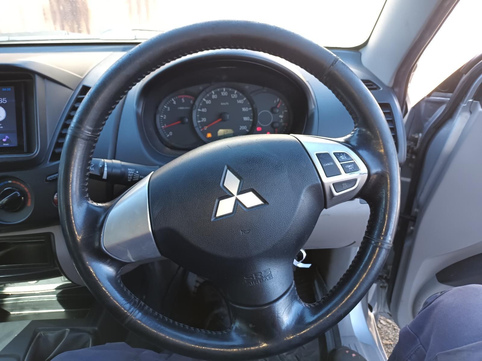 A Steering Wheel with a Mitsubishi Logo on It — South West 4WD Wreckers In Brisbane, QLD