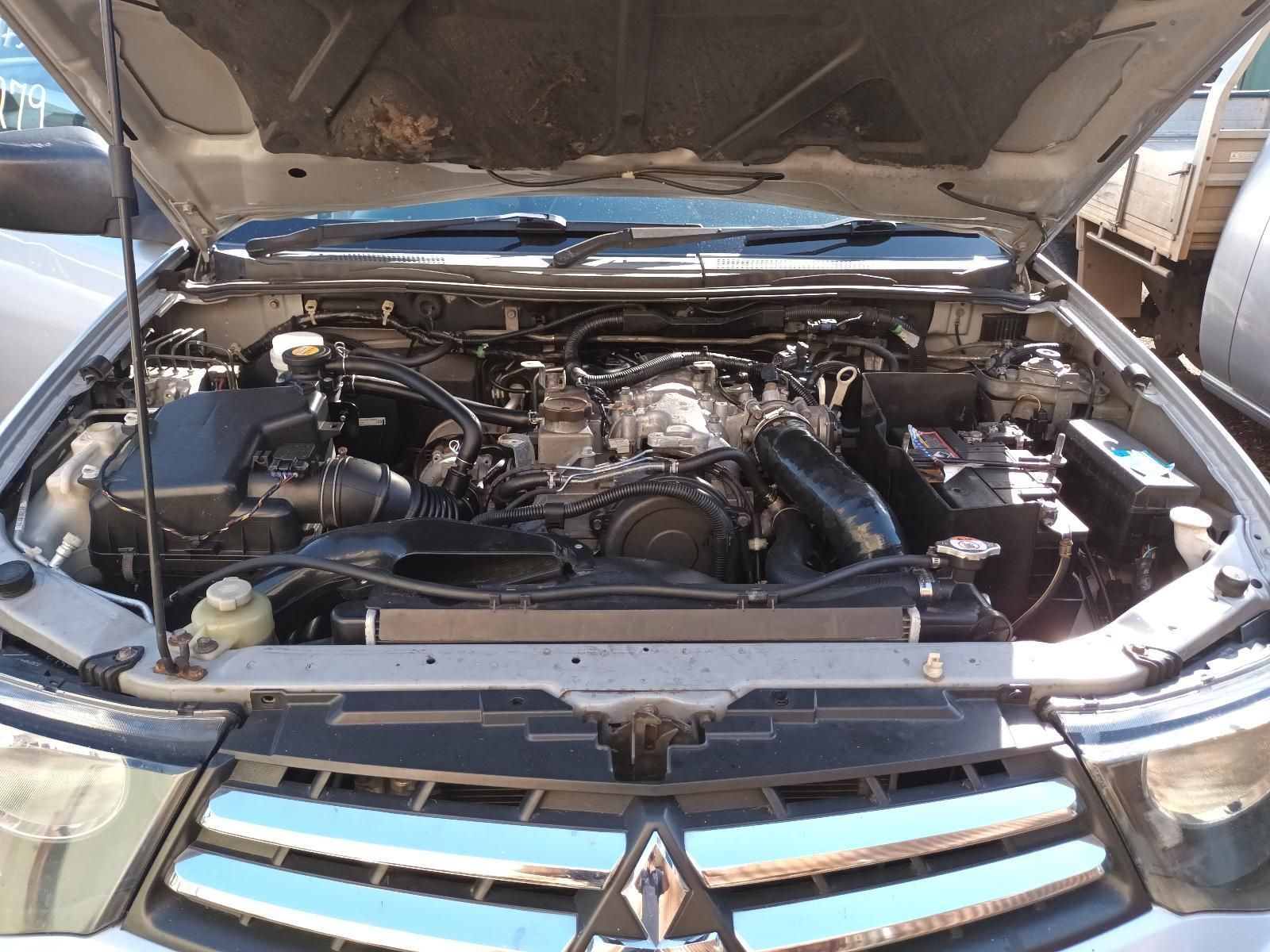 The Engine of a Mitsubishi Pajero with the Hood Open — South West 4WD Wreckers In Brisbane, QLD