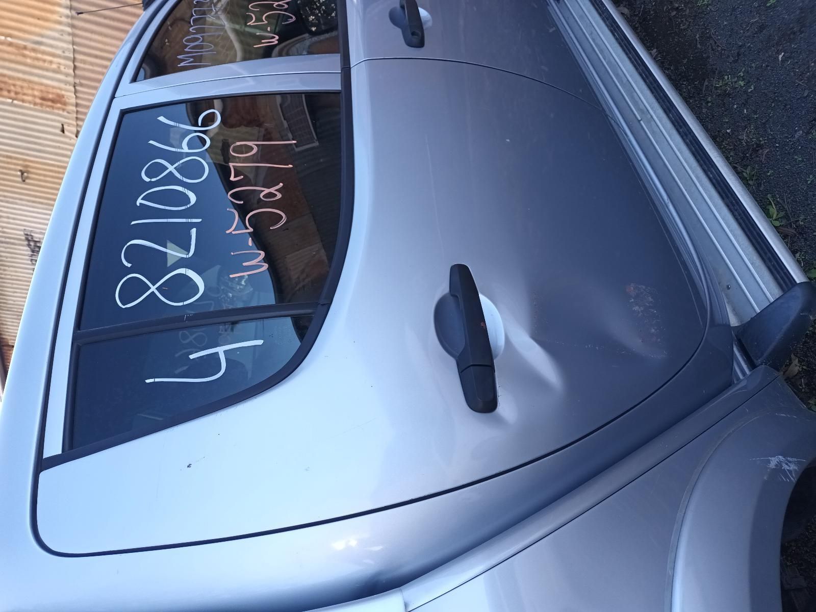 A Silver Car with the Numbers Written on the Window — South West 4WD Wreckers In Brisbane, QLD