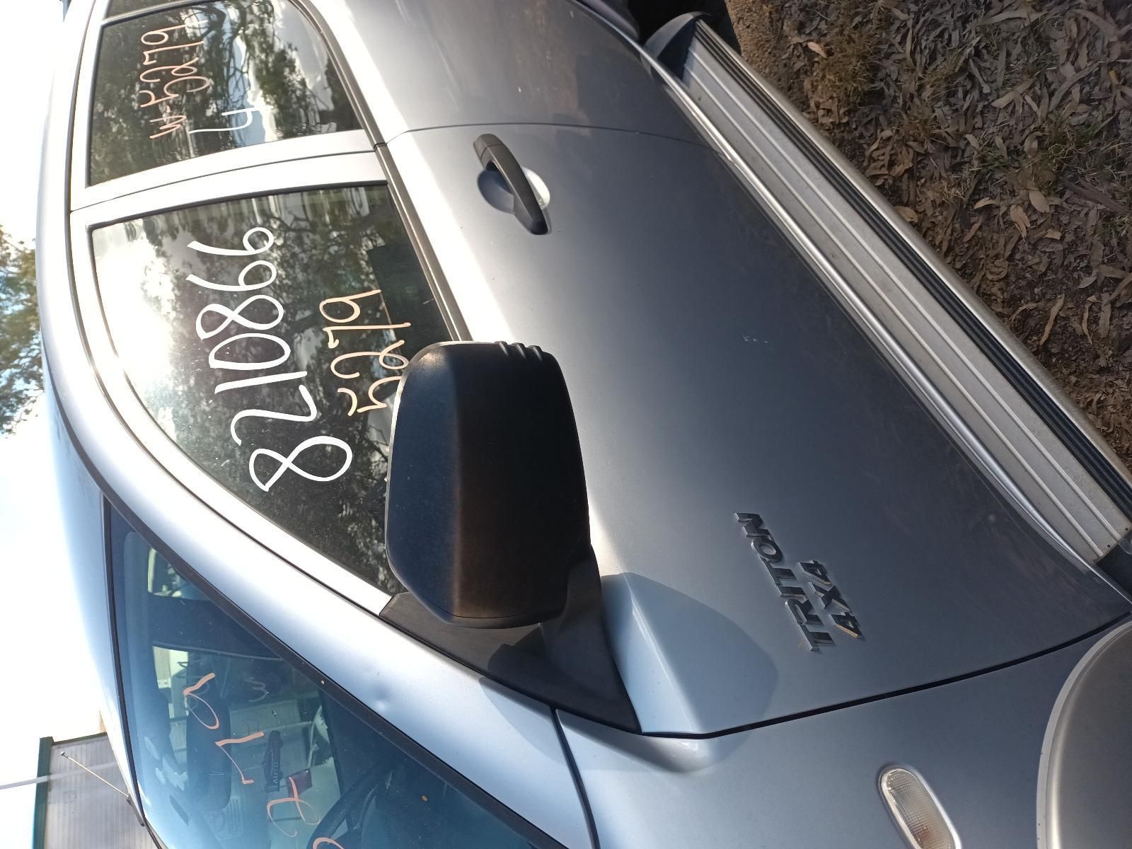 A Silver Car with the Numbers on the Side — South West 4WD Wreckers In Brisbane, QLD