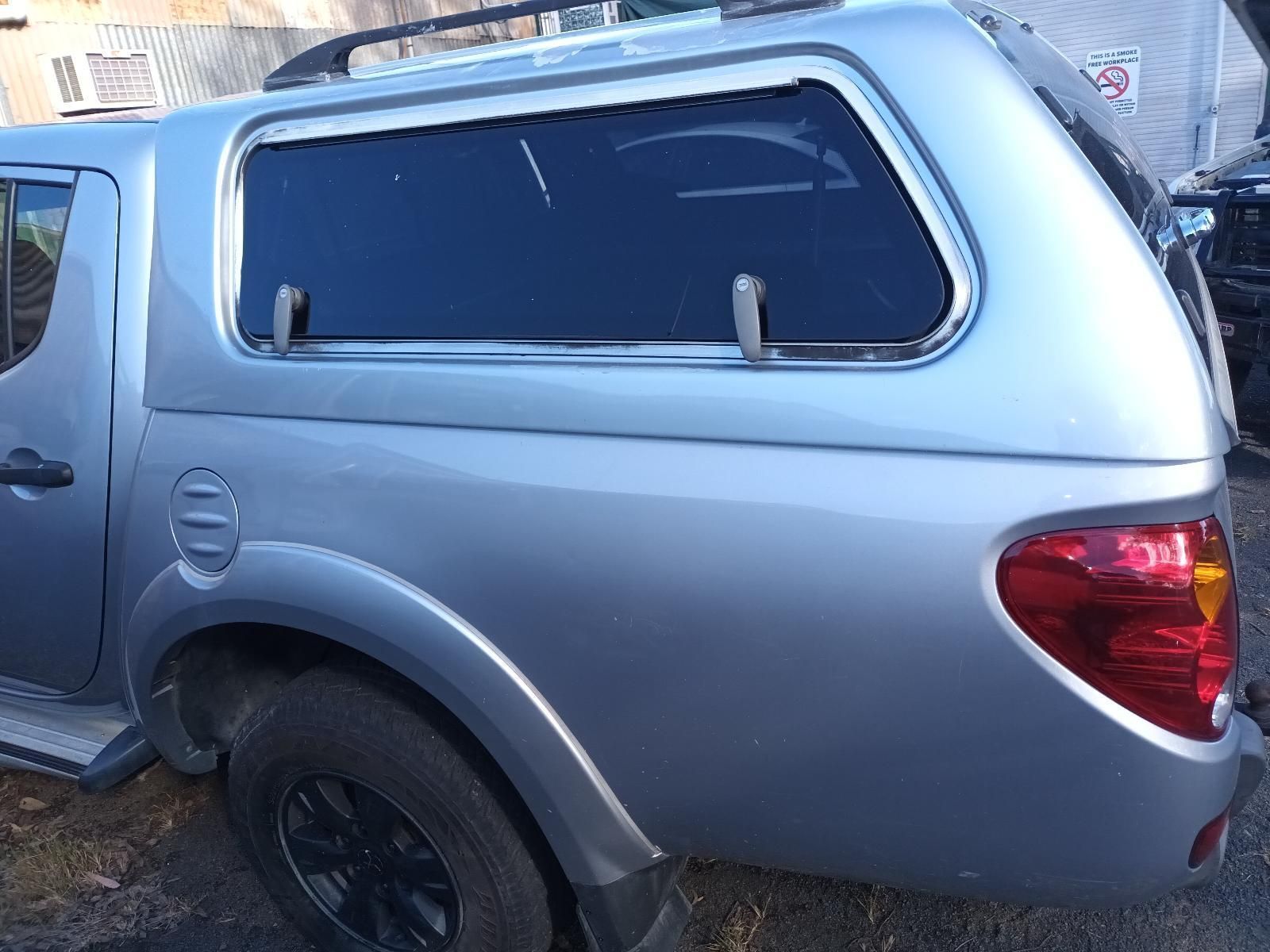 A Silver Truck with a Canopy on Top of It — South West 4WD Wreckers In Brisbane, QLD
