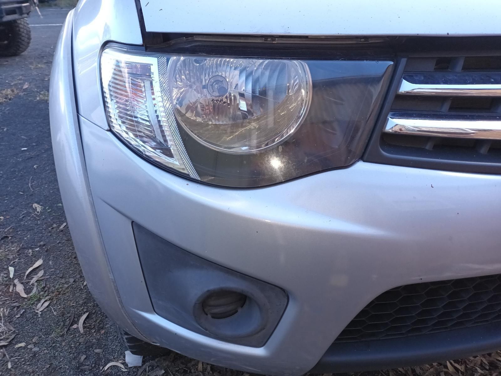 A Silver Car with the Hood Up is Parked on the Side of the Road — South West 4WD Wreckers In Brisbane, QLD