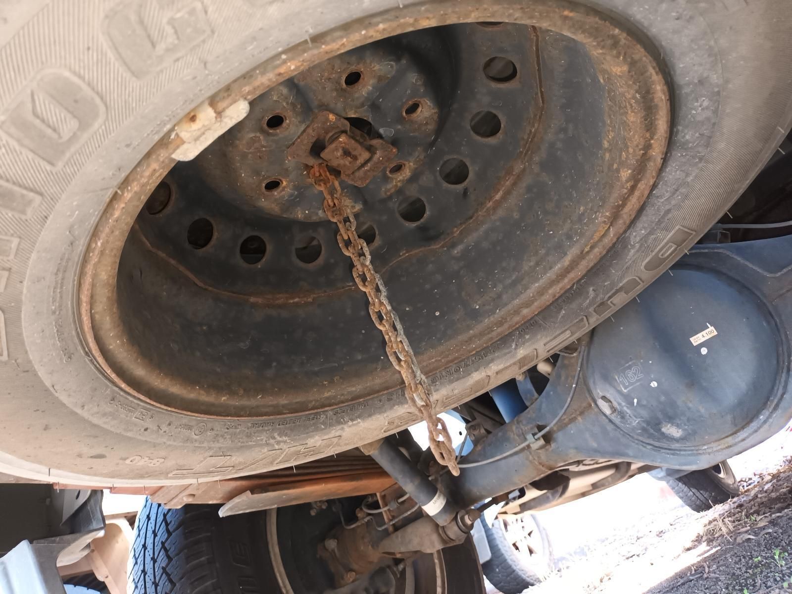A Close Up of a Tire on a Truck with a Chain Attached to It — South West 4WD Wreckers In Brisbane, QLD