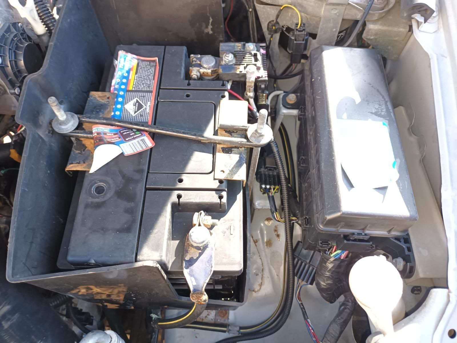 A Car Battery is Sitting in the Trunk of a Car — South West 4WD Wreckers In Brisbane, QLD