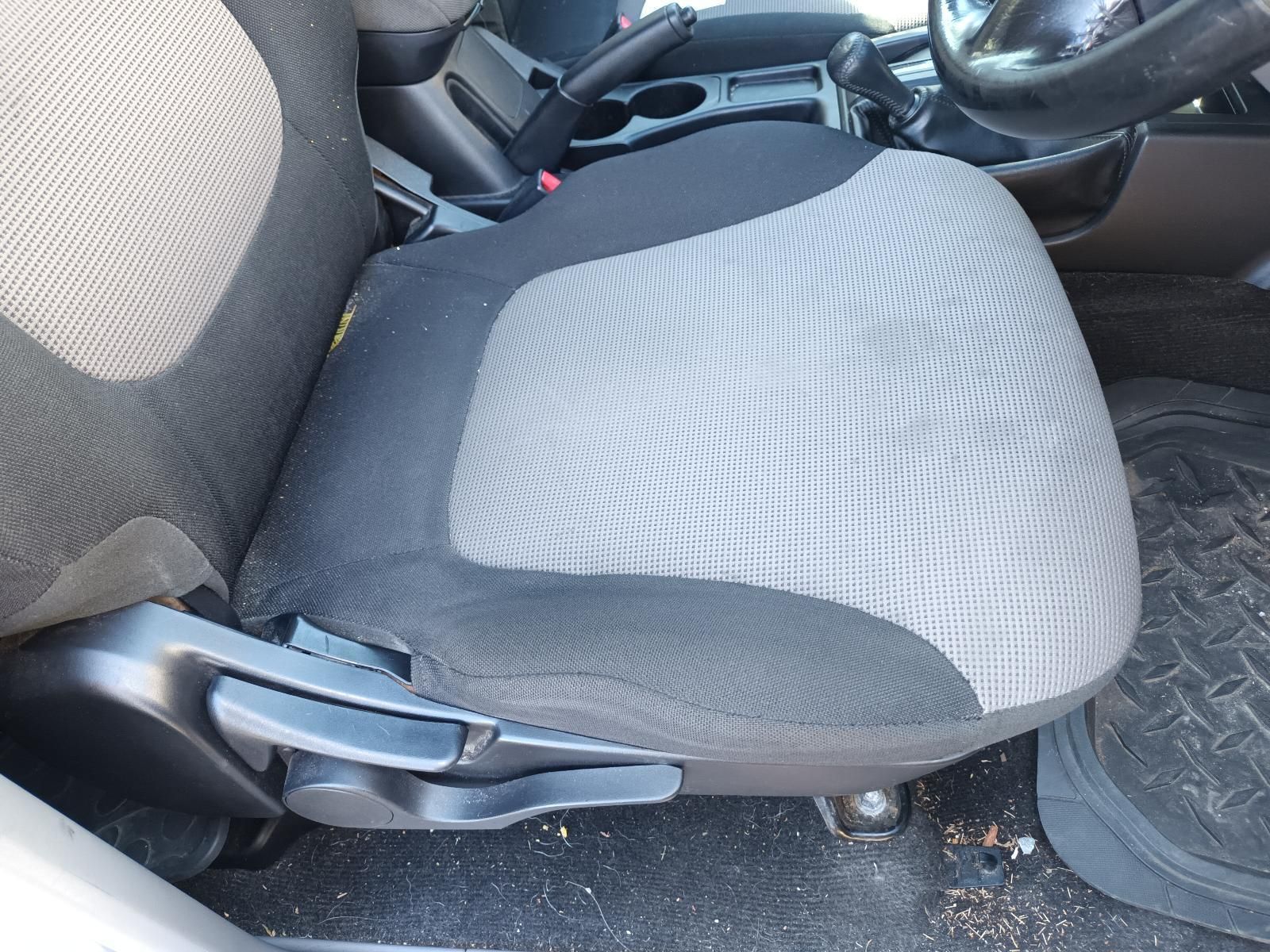 A Close Up of a Car Seat with a Steering Wheel in the Background — South West 4WD Wreckers In Brisbane, QLD