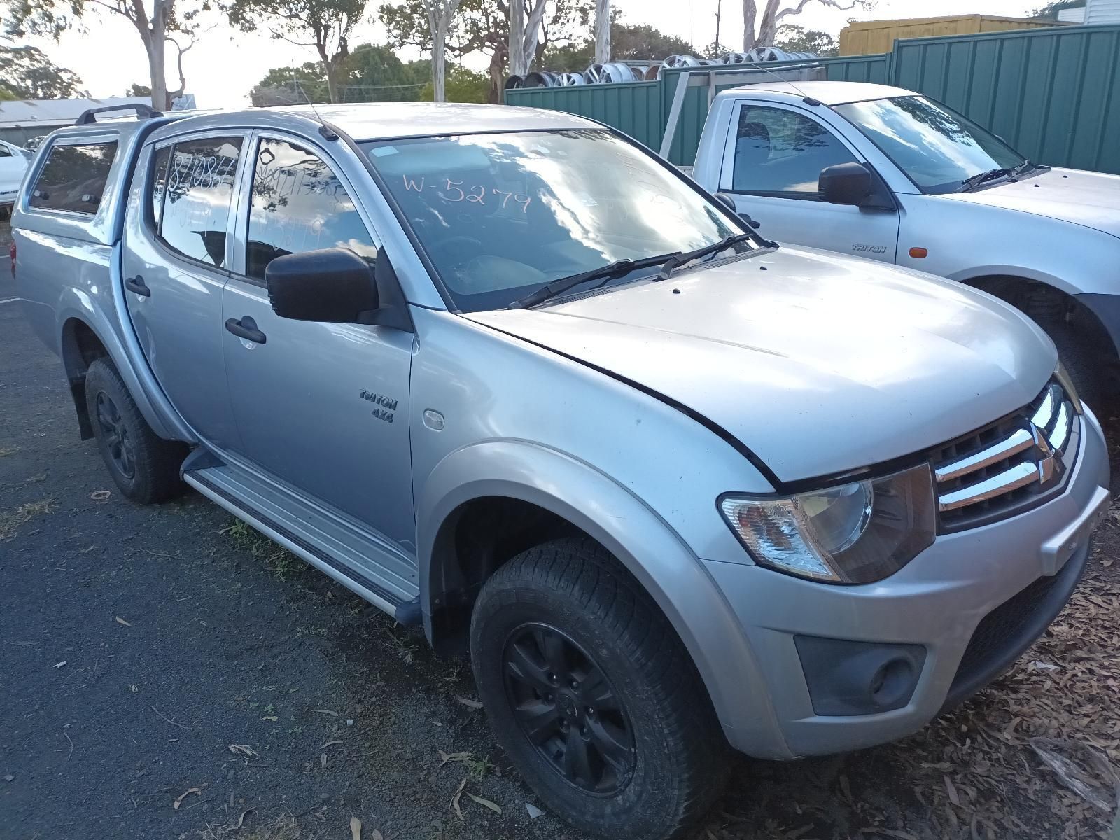 A Silver Truck is Parked on the Side of the Road — South West 4WD Wreckers In Brisbane, QLD