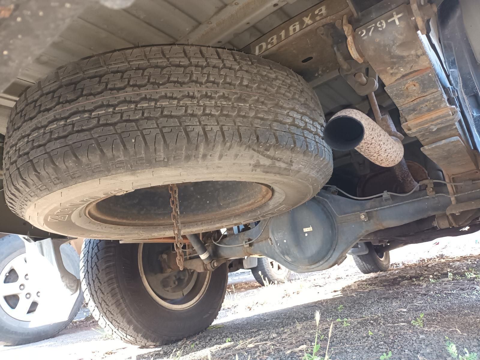 A Tire is Hanging from the Back of a Truck — South West 4WD Wreckers In Brisbane, QLD