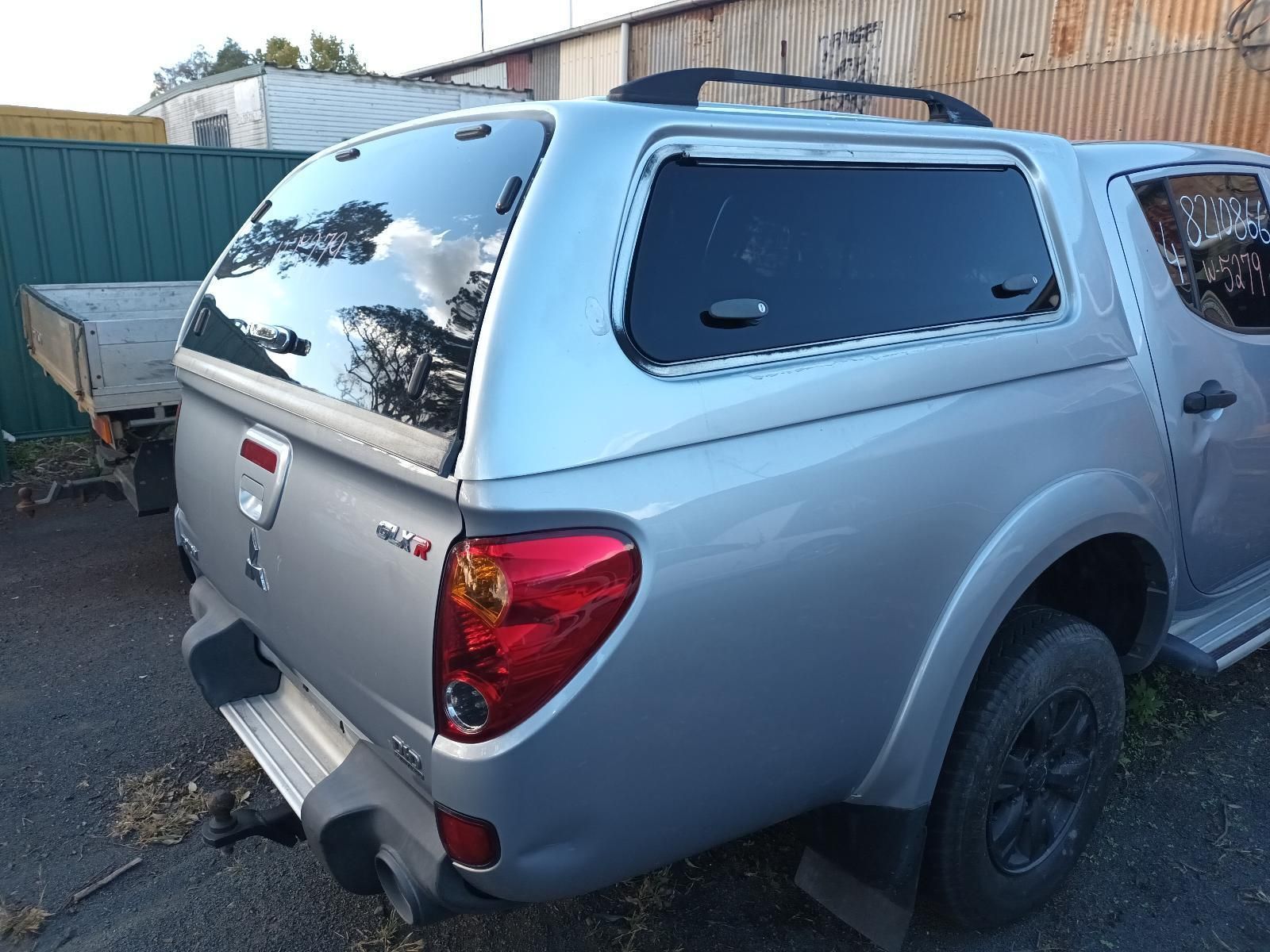 A Silver Truck with a Canopy on Top of It — South West 4WD Wreckers In Brisbane, QLD