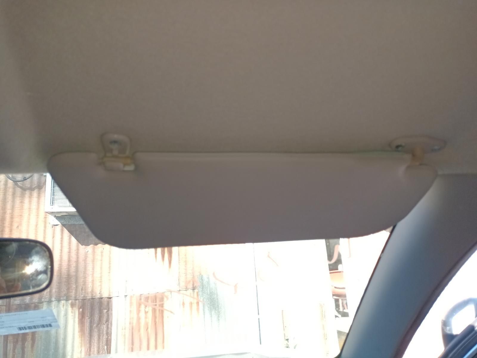 A Sun Visor is Attached to the Ceiling of a Car — South West 4WD Wreckers In Brisbane, QLD