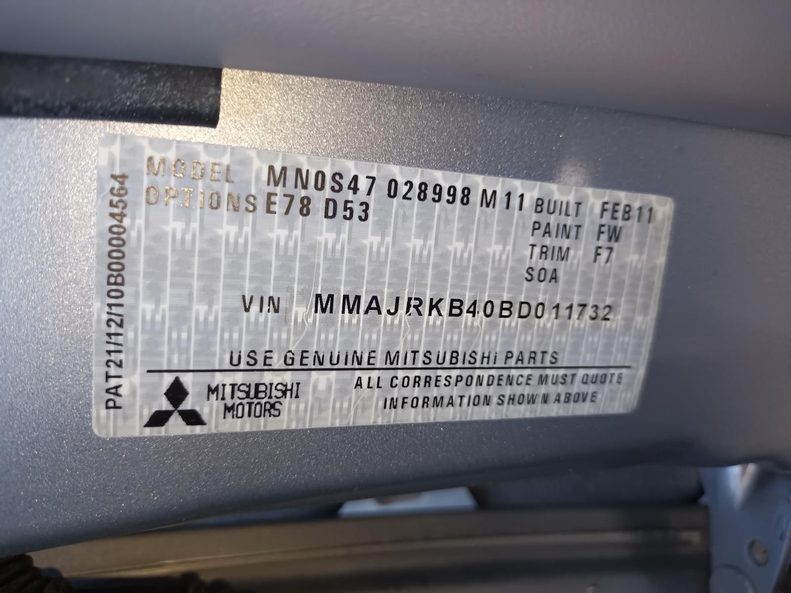 A Close Up of a Mitsubishi Motors License Plate — South West 4WD Wreckers In Brisbane, QLD