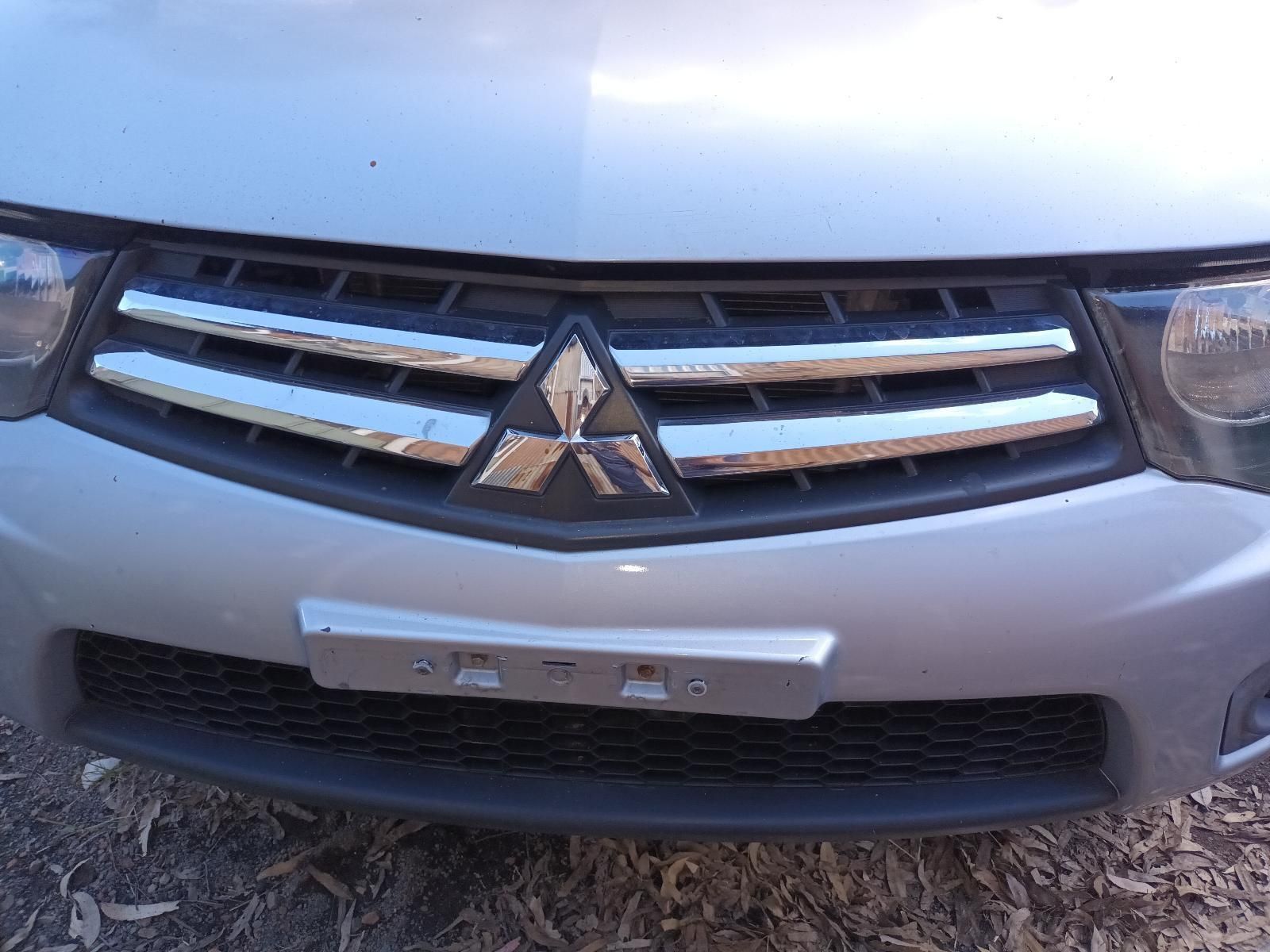 The Front Grille of a Silver Mitsubishi Car — South West 4WD Wreckers In Brisbane, QLD