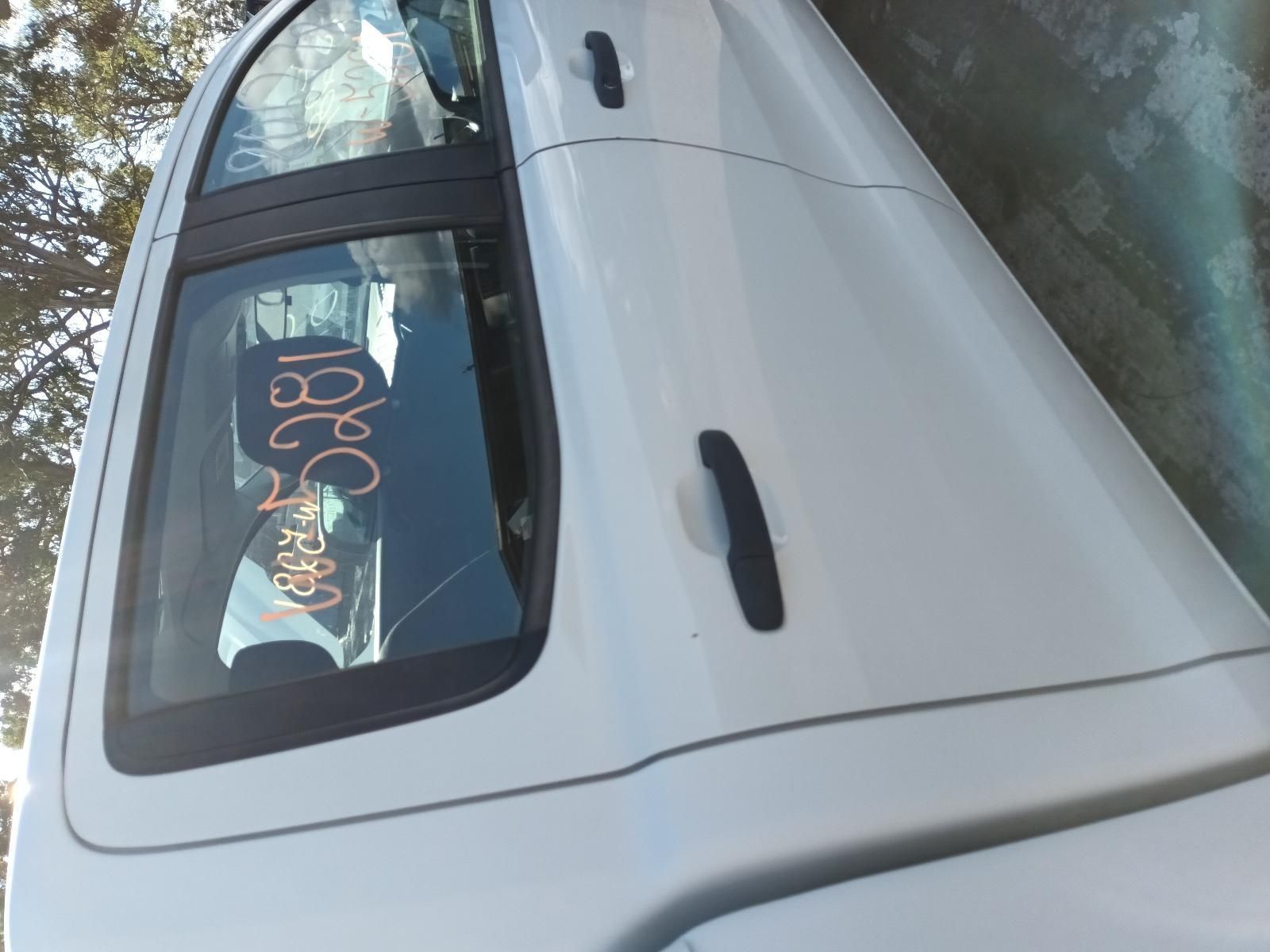 A White Car with a Written on the Back Window — South West 4WD Wreckers In Brisbane, QLD