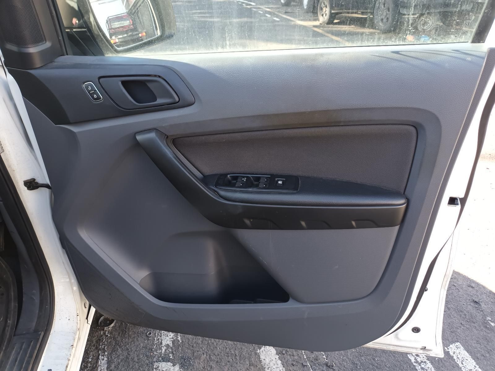 A White Car with the Door Open and a Black Door Panel — South West 4WD Wreckers In Brisbane, QLD