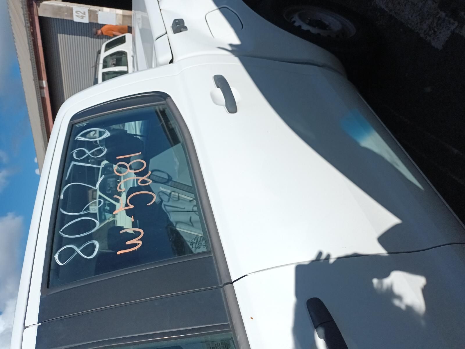 A White Car with Numbers Written on the Back Window — South West 4WD Wreckers In Brisbane, QLD