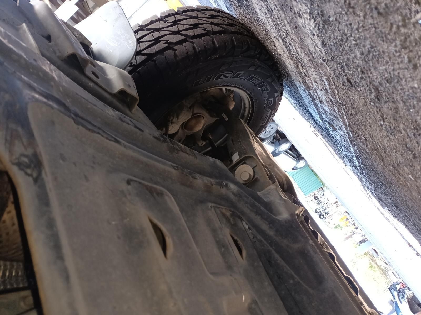 A Close Up of the Underside of a Car with a Tire on It — South West 4WD Wreckers In Brisbane, QLD
