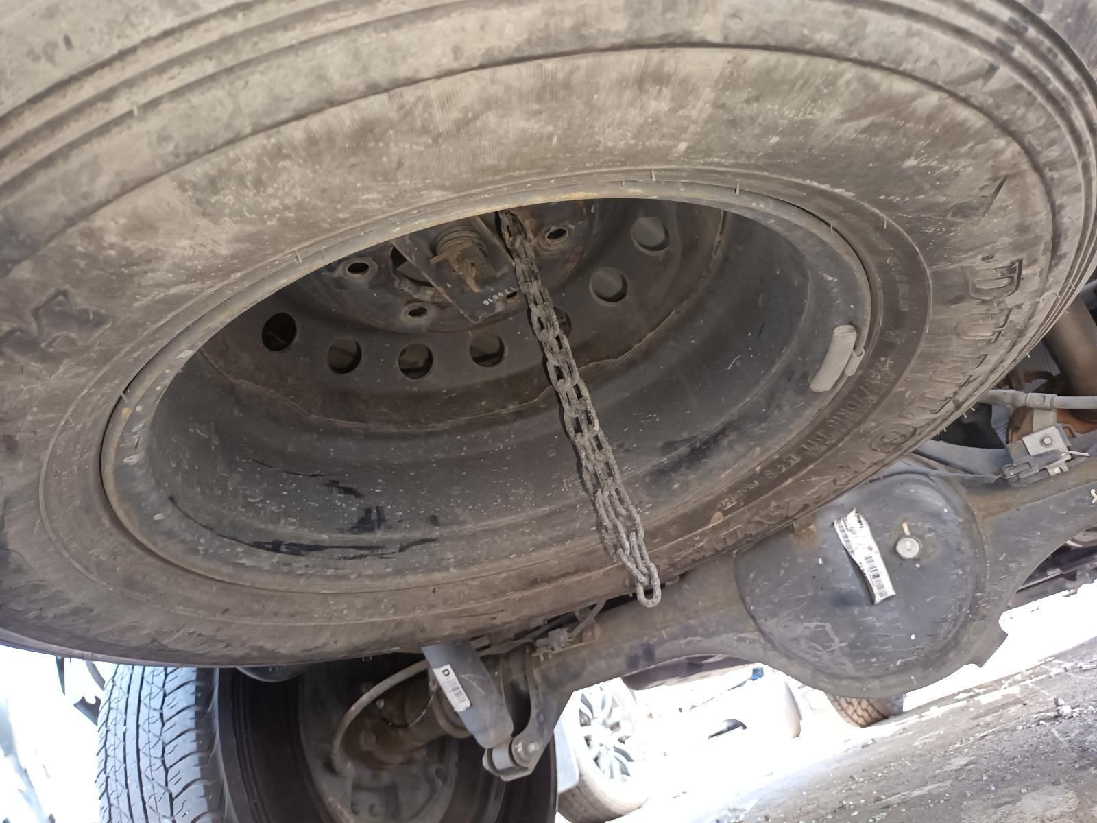 A Close Up of a Tire with a Chain Attached to It — South West 4WD Wreckers In Brisbane, QLD