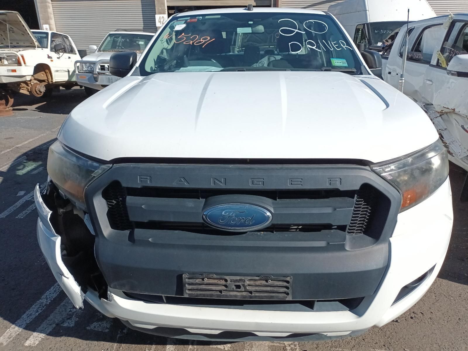 A White Ford Ranger is Parked in a Parking Lot — South West 4WD Wreckers In Brisbane, QLD