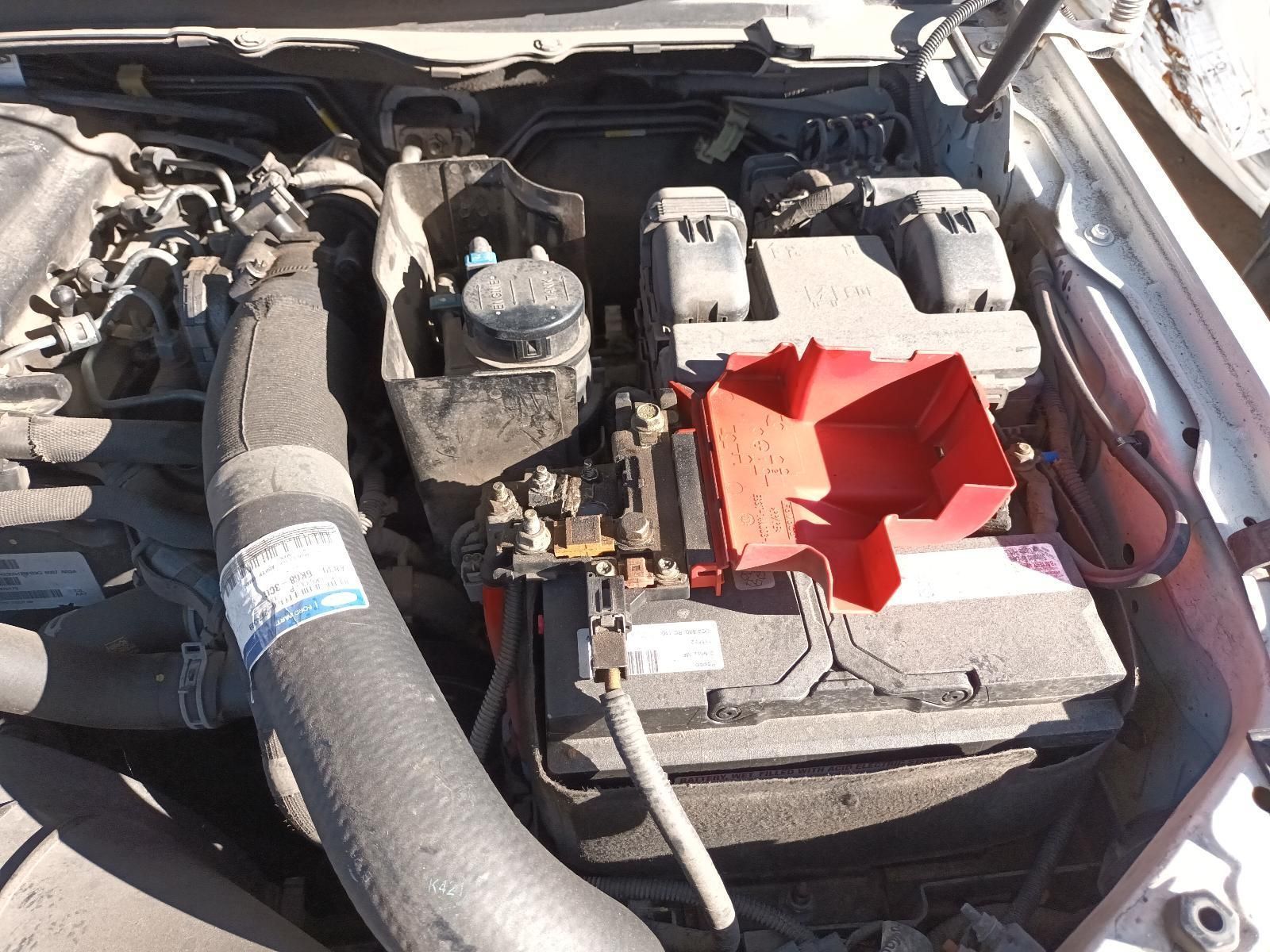 A Close Up of a Car Engine with a Battery in It — South West 4WD Wreckers In Brisbane, QLD