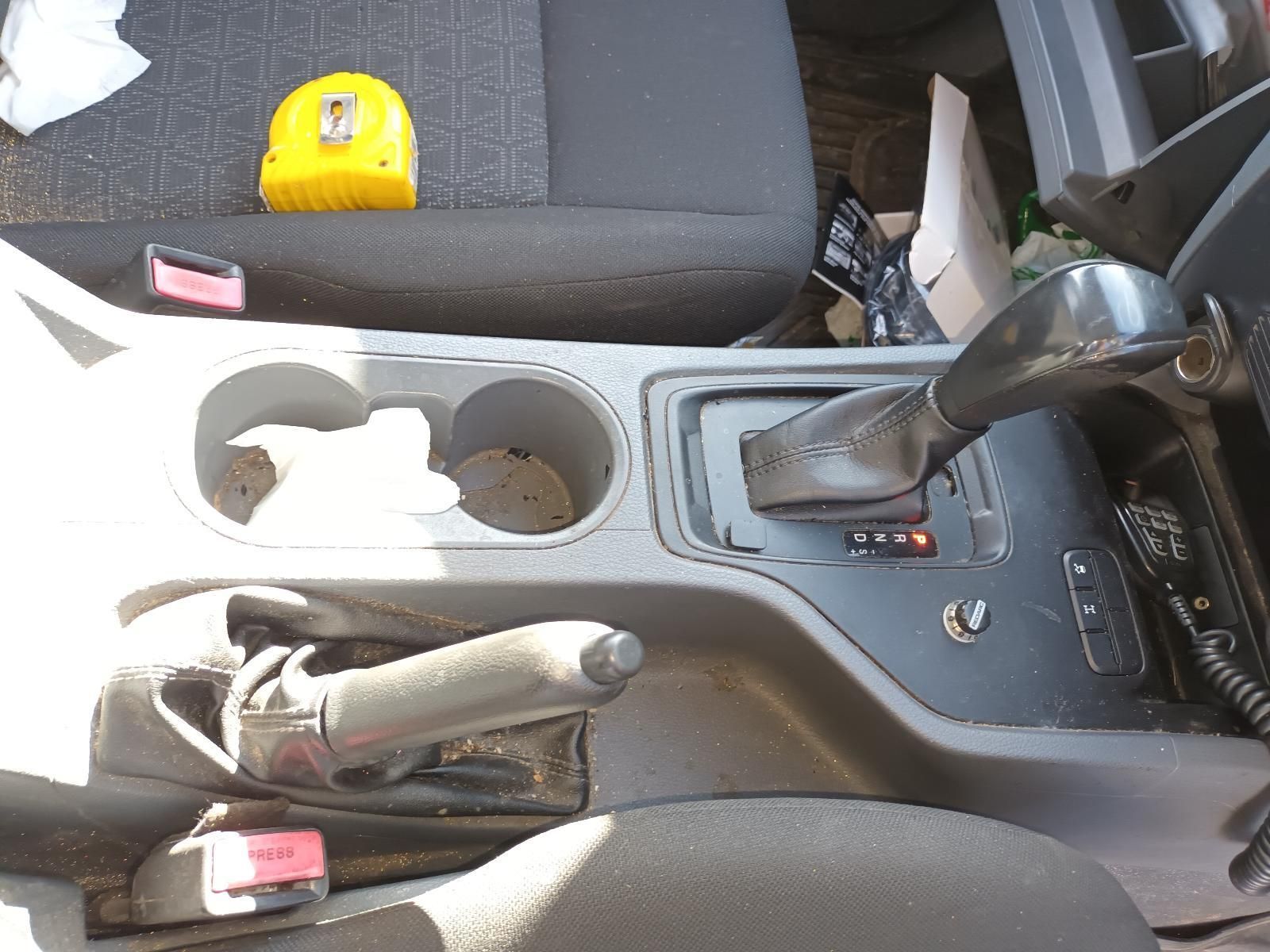 The Inside of a Car with a Cup Holder and a Tape Measure — South West 4WD Wreckers In Brisbane, QLD