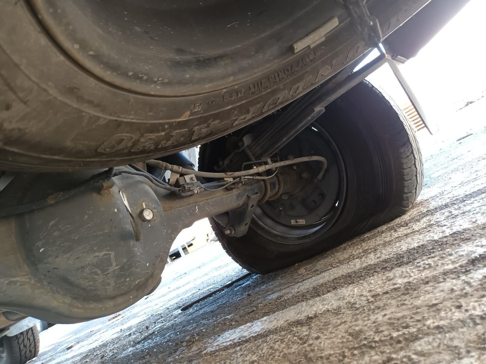 A Close Up of the Underside of a Car with a Flat Tire — South West 4WD Wreckers In Brisbane, QLD