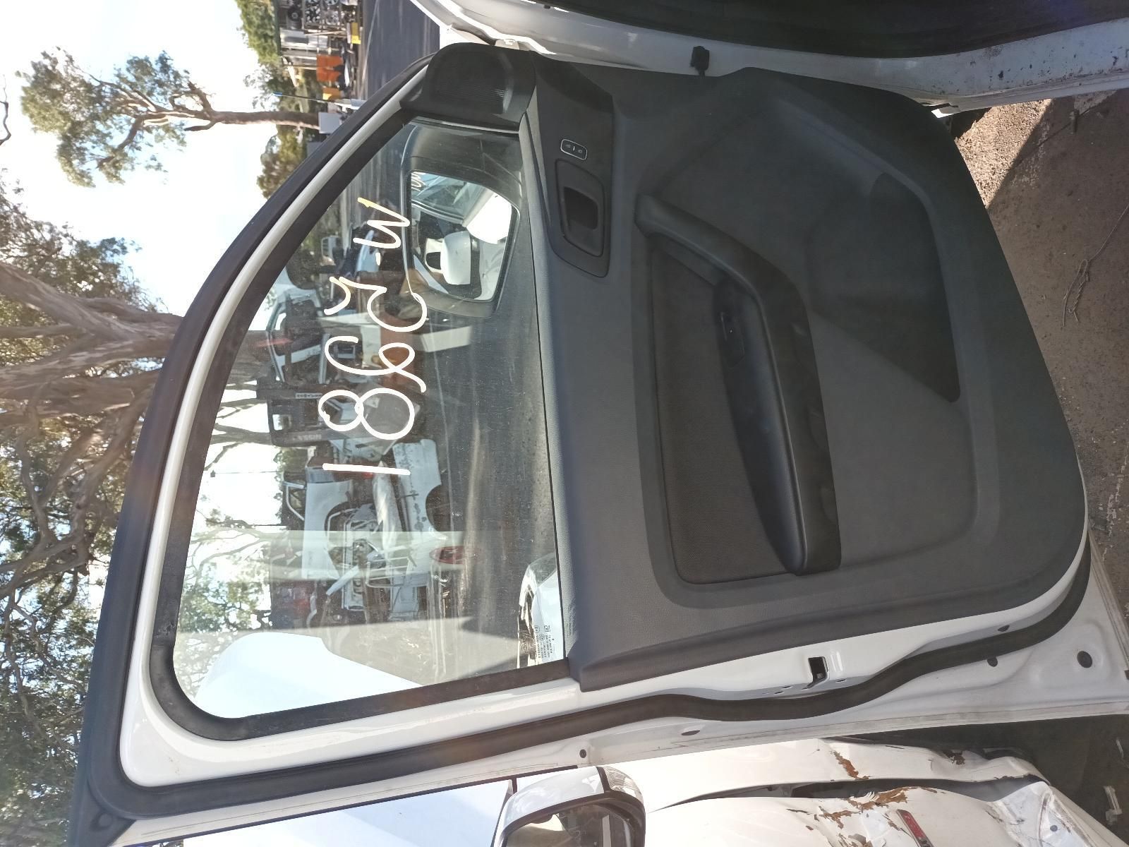 A White Car is Parked on the Side of the Road with the Door Open — South West 4WD Wreckers In Brisbane, QLD