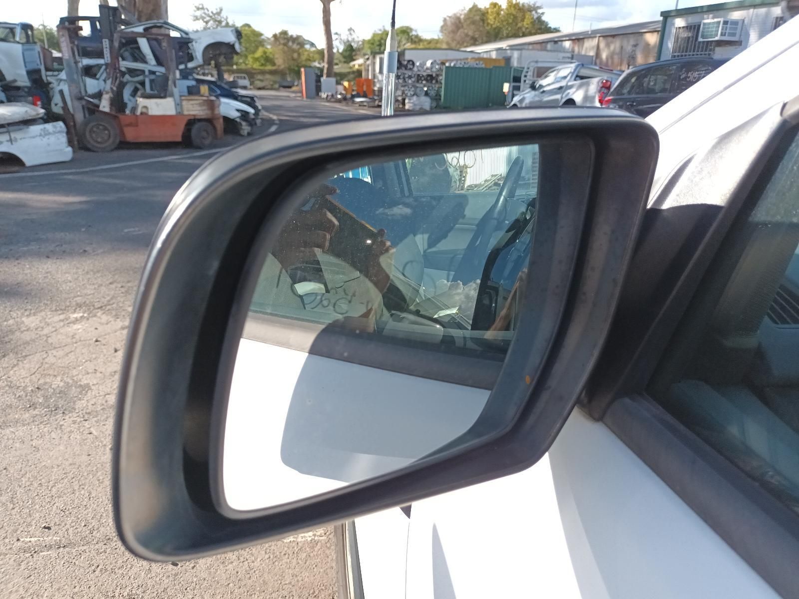 A Close Up of a Side View Mirror on a White Car — South West 4WD Wreckers In Brisbane, QLD