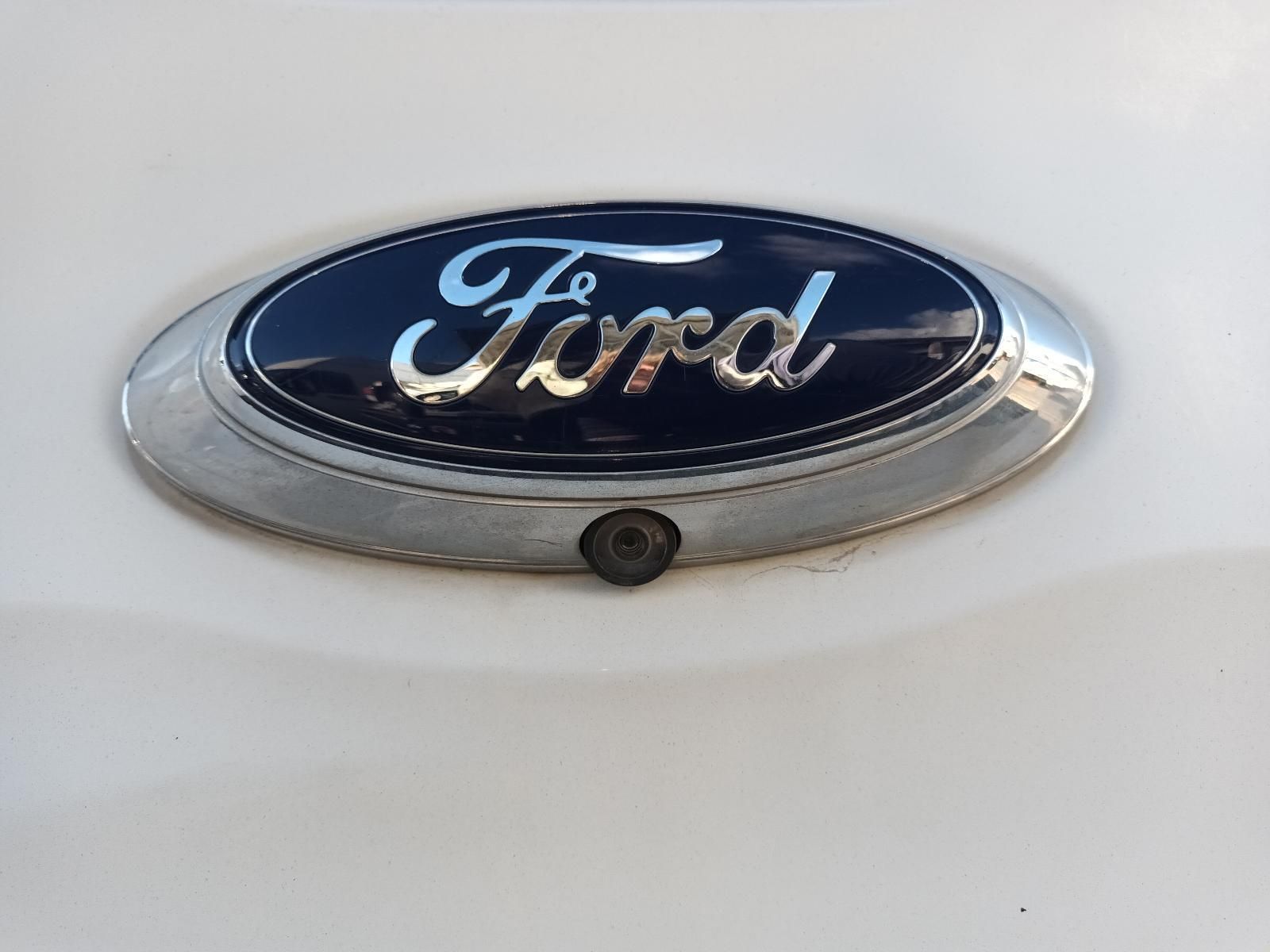 A Close Up of a Ford Emblem on a White Car — South West 4WD Wreckers In Brisbane, QLD