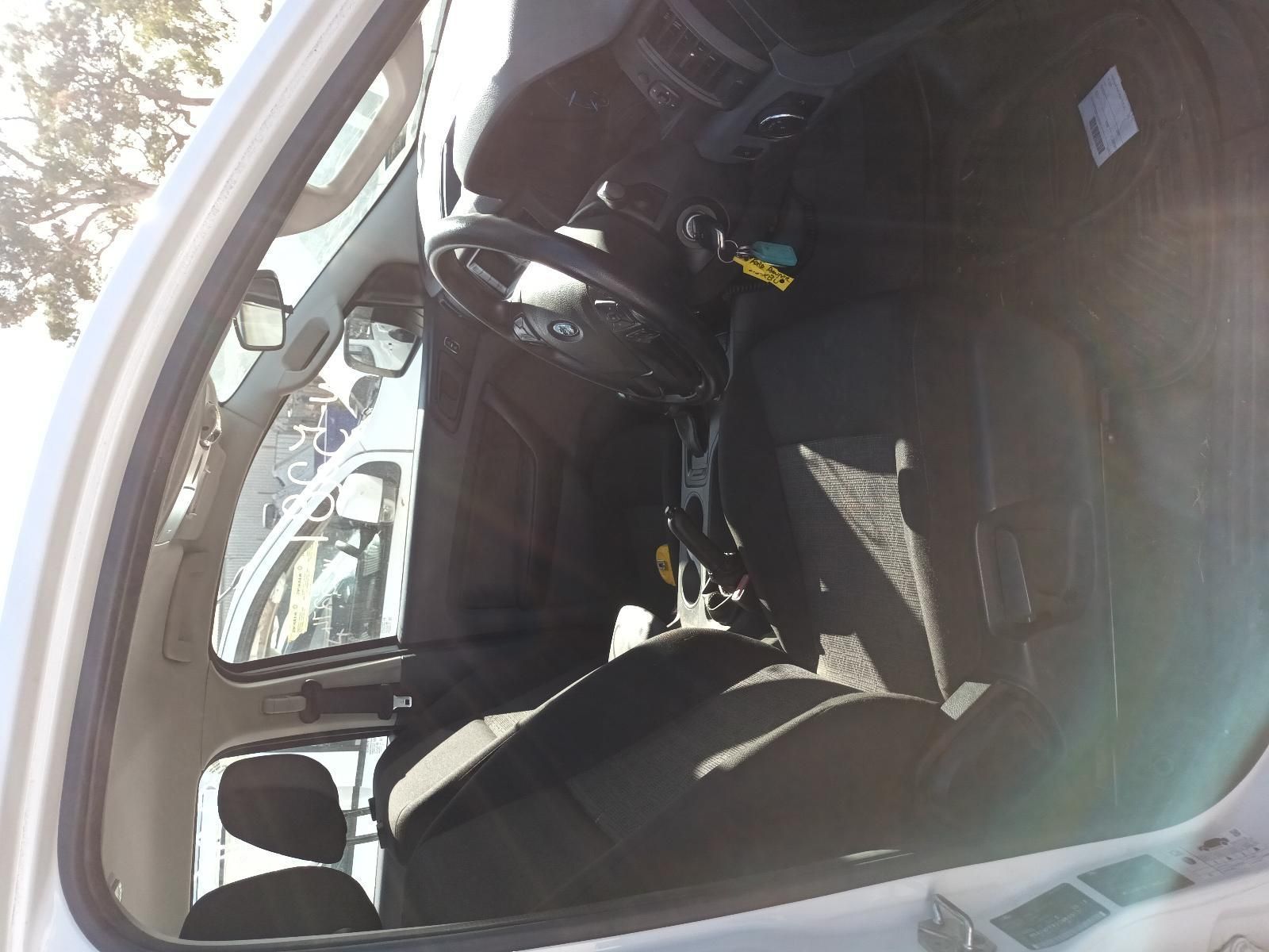 A White Car with a Black Seat and Steering Wheel — South West 4WD Wreckers In Brisbane, QLD