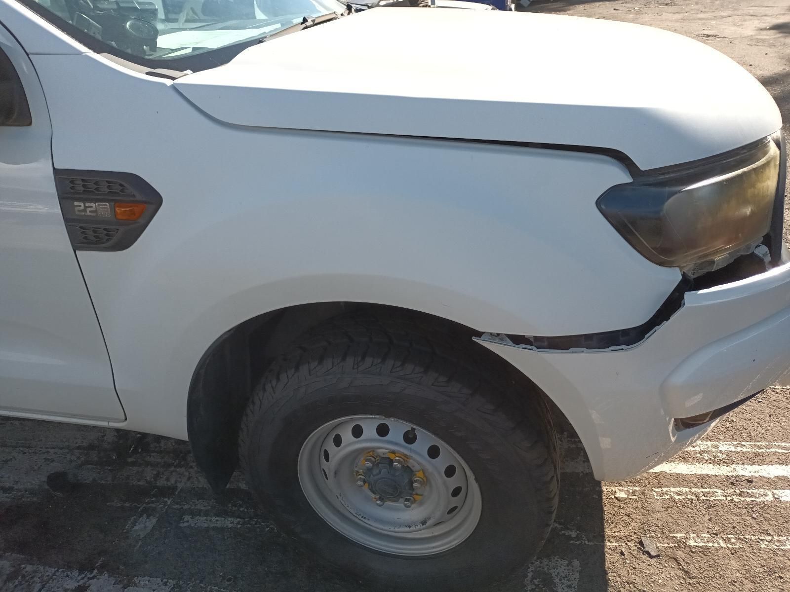A White Truck with a Damaged Front Bumper is Parked in a Parking Lot — South West 4WD Wreckers In Brisbane, QLD
